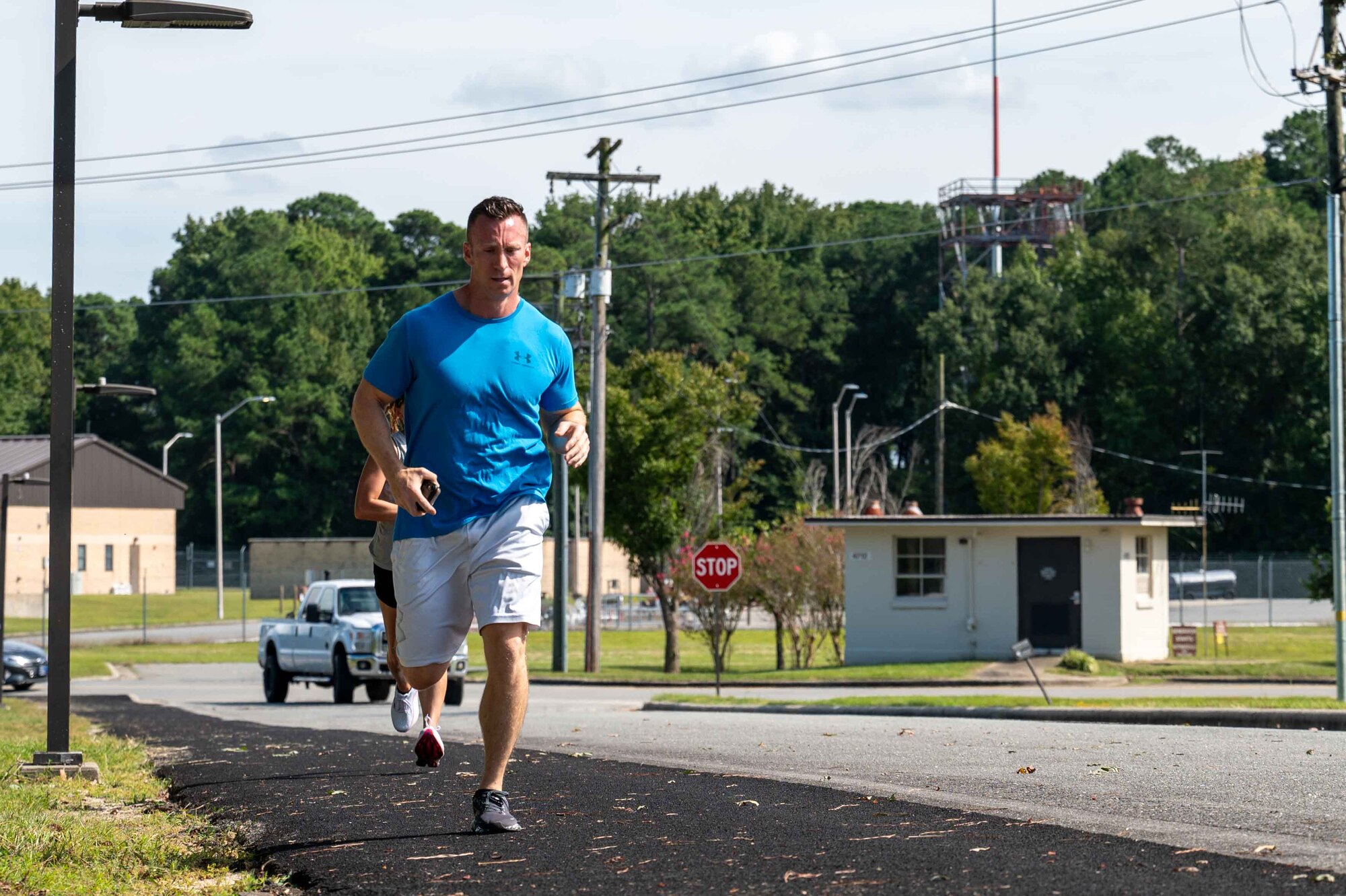 U.S. Air Force Master Sgt. Austin Puente, 4th Comptroller Squadron first sergeant, participates in a 9/11 memorial run at Seymour Johnson Air Force Base, North Carolina, Sept. 11, 2024. The memorial run was held to honor and remember the first responders and those who lost their lives on Sept. 11, 2001. (U.S. Air Force photo by Airman 1st Class Rebecca Tierney)