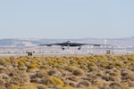 A B-21 Raider conducts flight testing, which includes ground testing, taxiing, and flying operations, at Edwards Air Force Base, California. The B-21 will be the backbone of the service’s future bomber force, and will possess the range, access and payload to penetrate the most highly-contested threat environments and hold any target around the globe at risk. The bomber platform is being developed through the Department of the Air Force Rapid Capabilities Office, which utilizes streamlined methods to develop, produce and field critical combat capabilities. (Courtesy photo)