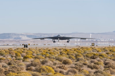 A B-21 Raider conducts flight testing, which includes ground testing, taxiing, and flying operations, at Edwards Air Force Base, California. The B-21 will be the backbone of the service’s future bomber force, and will possess the range, access and payload to penetrate the most highly-contested threat environments and hold any target around the globe at risk. The bomber platform is being developed through the Department of the Air Force Rapid Capabilities Office, which utilizes streamlined methods to develop, produce and field critical combat capabilities. (Courtesy photo)