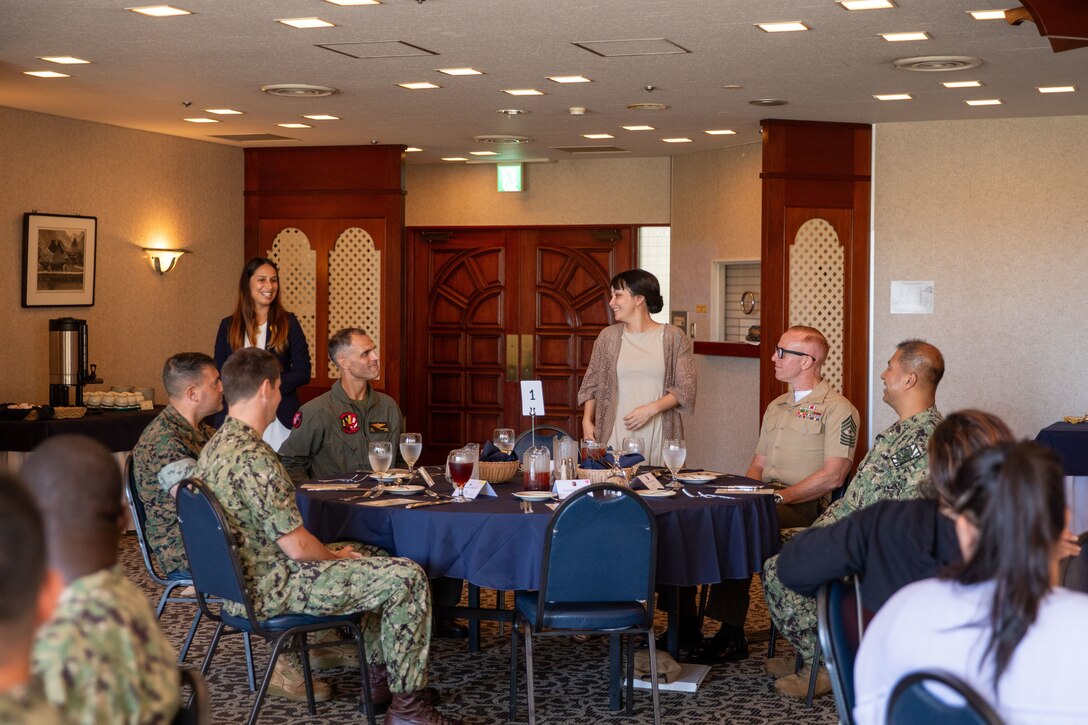 Alyse Parsons, center, the Ombudsman for Headquarters and Headquarters Squadron, Marine Corps Air Station Iwakuni, introduces herself during the 2024 Ombudsman appreciation luncheon at Marine Corps Air Station Iwakuni, Japan, Sept. 12, 2024. This event was held in celebration of the 54th anniversary of the Ombudsman Program and to recognize the work of the MCAS Iwakuni Ombudsmen, who are volunteers appointed by the commanding officer to share information and advocate for family members connected to the command. (U.S. Marine Corps Photo by Cpl. Calah Thompson)