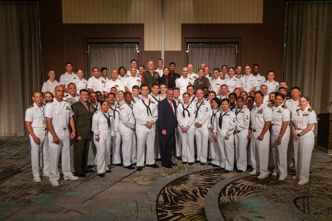 U.S. Marines and sailors pose for a group photo with the Honorable Dr. Lester Martinez-Lopez, center, the assistant secretary of defense for health affairs and a native of Puerto Rico, at the Grand Prince Hotel Hiroshima during an Iwakuni and Hiroshima medical executive symposium on Sept. 13, 2024. The Naval Family Branch Clinic Iwakuni hosted a symposium to bring host nation medical assets and Japanese medical forces together to strengthen ties with U.S. Indo-Pacific command allies and reinforce civilian partnerships. (U.S. Marine Corps photo by Sgt. Phuchung Nguyen)