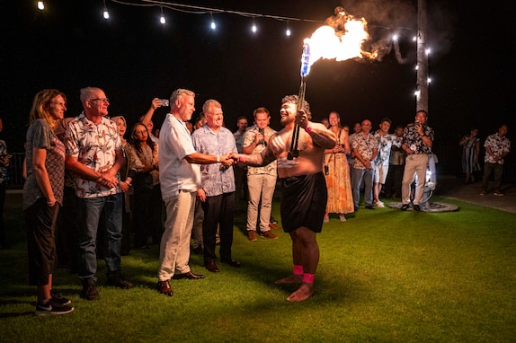 Chief Makoa of Traditions Hawaii shakes hands with Royal Netherlands Navy Adm. Rob Bauer, Chair of the Military Committee for NATO, while performing a fire dance at the welcoming reception for the 26th annual Indo-Pacific Chiefs of Defense conference, in Kona, Hawaii, Sept. 18. Senior military leaders from 28 countries and multilateral entities attended the conference, titled "The Future Indo-Pacific: Building a Resilient and Interconnected Region," to build on and strengthen relationships to enhance mutual understanding, cooperation and a consistent operational framework, while underscoring international commitment to protecting shared interests across the Indo-Pacific. (U.S. Navy photo by Mass Communication Specialist 1st Class John Bellino)