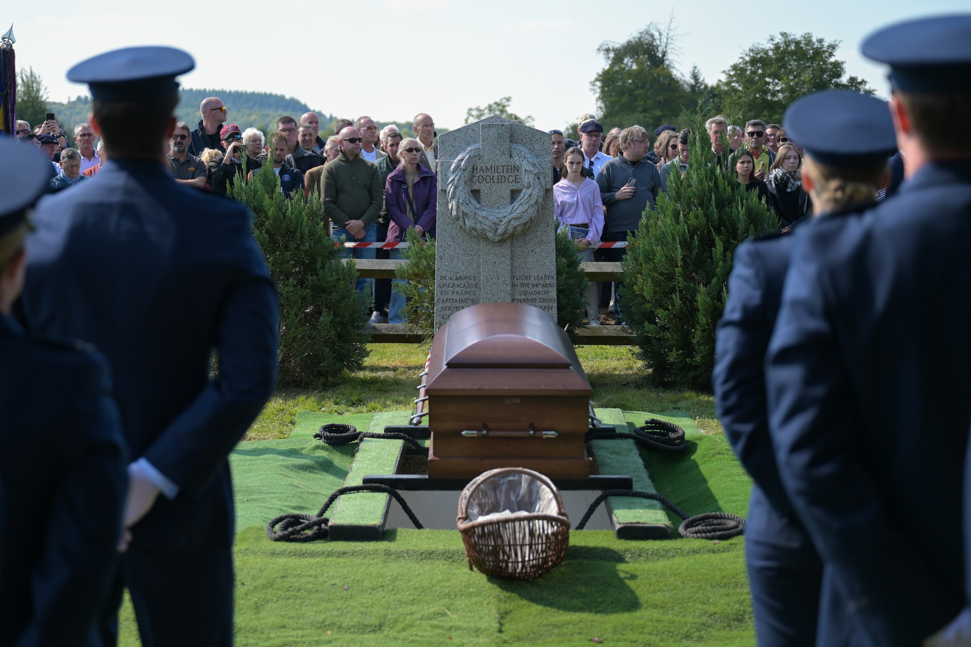 CHEVIÈRES, France – U.S. Air Force Airmen from the 94th Fighter Squadron pay their respects during the reinterment of Capt. Hamilton Coolidge in Chevières, France, Sept. 15, 2024. Coolidge, a pilot with the 94th Aero Squadron during World War I, was killed in action in 1918. The event marked a poignant moment of remembrance for those who served and gave their lives during the war. (U.S. Air Force photo by Staff Sergeant Nicole Molignano)