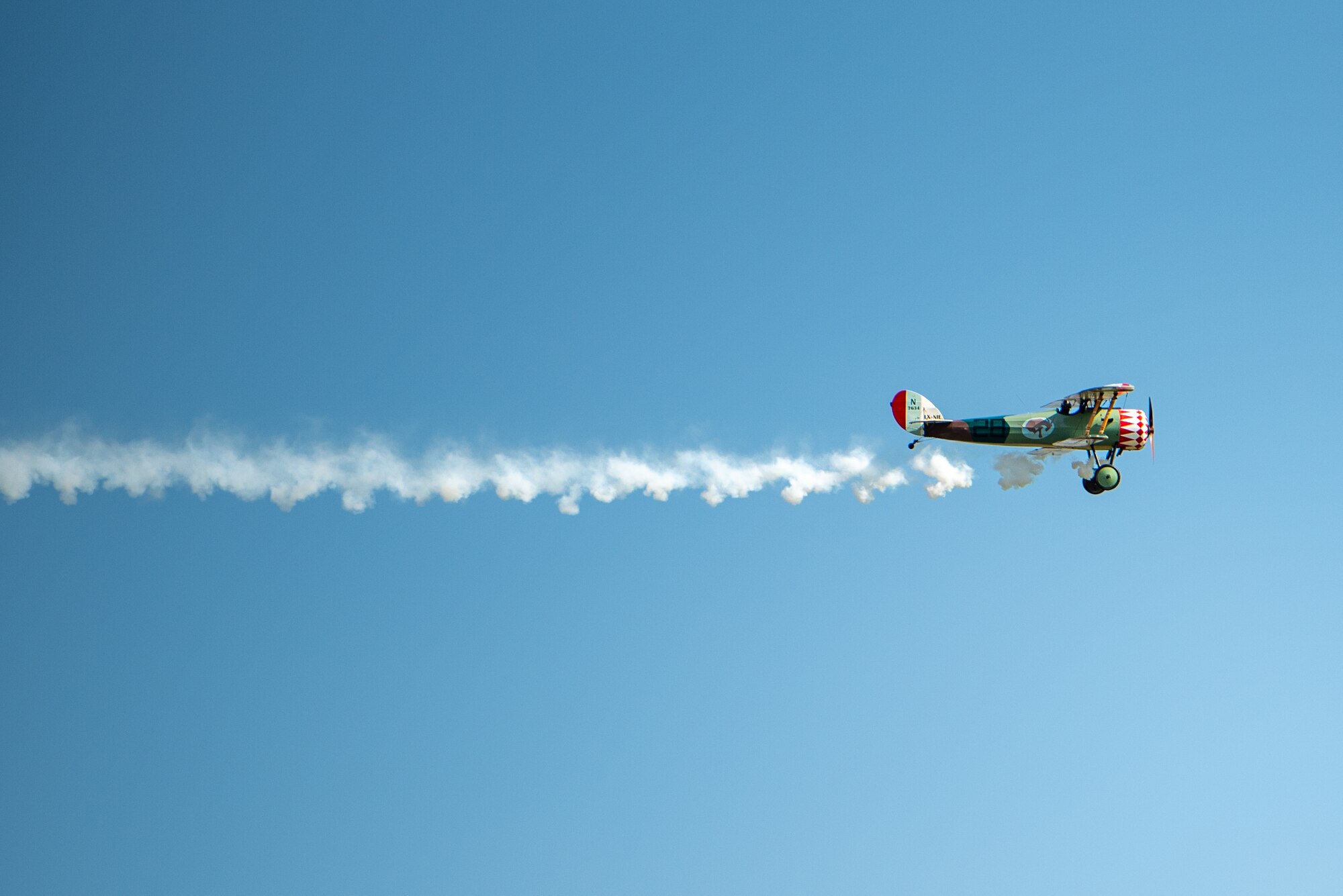 CHEVIÈRES, France – Paul Suace, local pilot, flies a Nieuport 28 during the reinterment ceremony for Capt. Hamilton Coolidge in Chevières, France, Sept. 15, 2024. Coolidge, who flew a similar aircraft frame in combat during World War I, was posthumously honored with this ceremony more than a century after his death. (U.S. Air Force photo by Airman 1st Class Albert Morel)