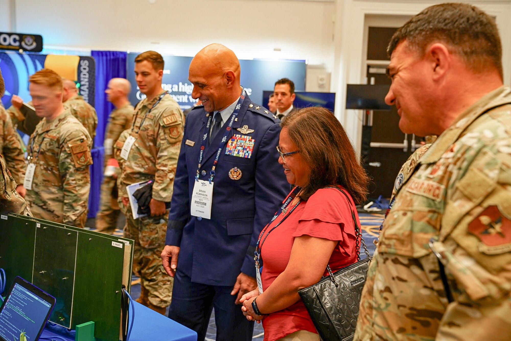 Lt. Gen. Brian Robinson, commander of Air Education and Training Command, listens to Second Air Force presenters at the Air, Space and Cyber Conference, National Harbor, Md., Sept. 16, 2024.