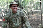 U.S. Air National Guard Staff Sgt. Theodore Salyers, a member of the 247th Intelligence Squadron, walks in the woods while evading SERE instructors at the Volunteer Training Site Tullahoma, Tennessee , Sept. 4-8, 2024. Airmen from the 247th IS received hands-on Readiness Airmen Training.