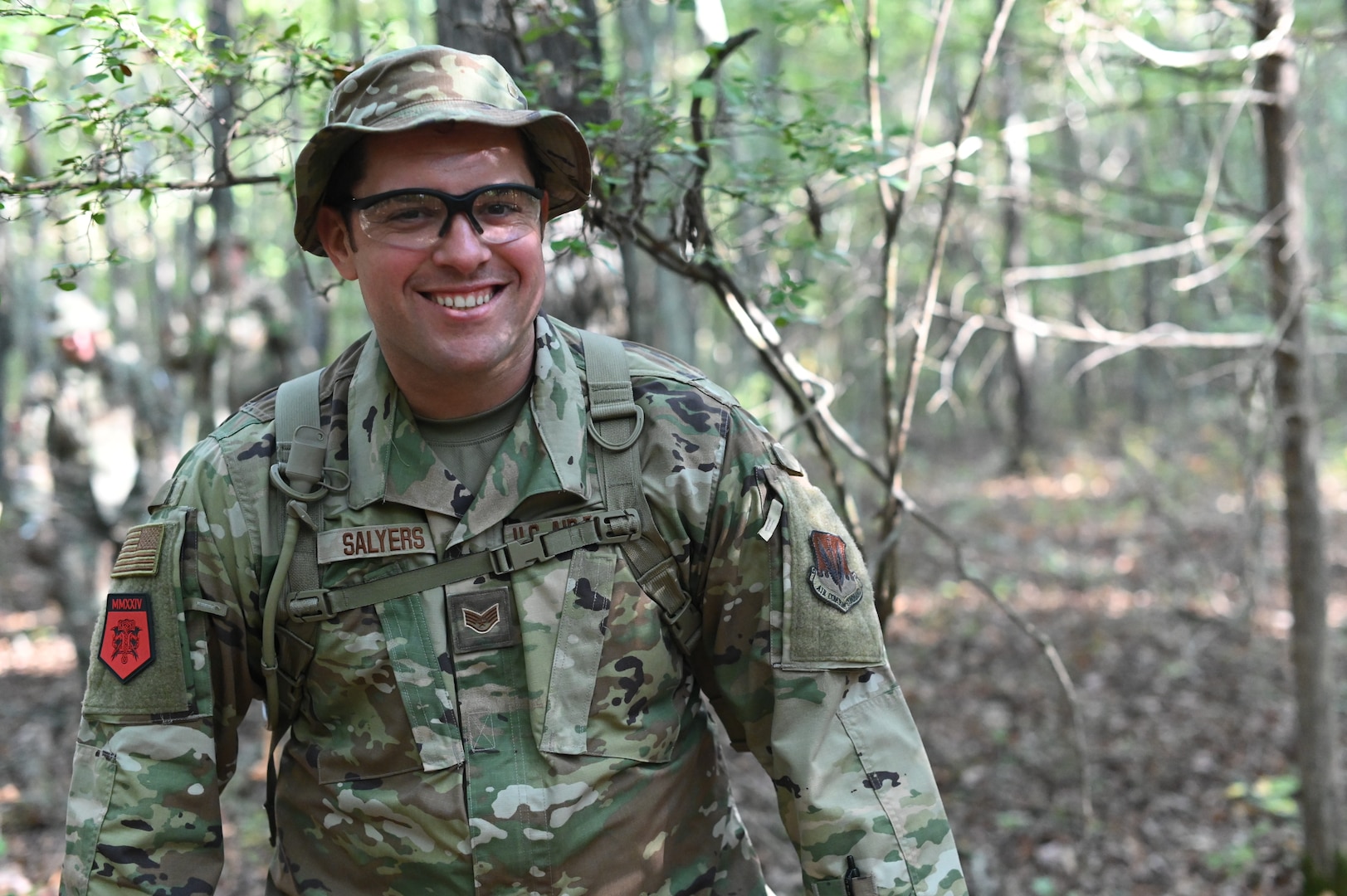 U.S. Air National Guard Staff Sgt. Theodore Salyers, a member of the 247th Intelligence Squadron, walks in the woods while evading SERE instructors at the Volunteer Training Site Tullahoma, Tennessee , Sept. 4-8, 2024. Airmen from the 247th IS received hands-on Readiness Airmen Training.