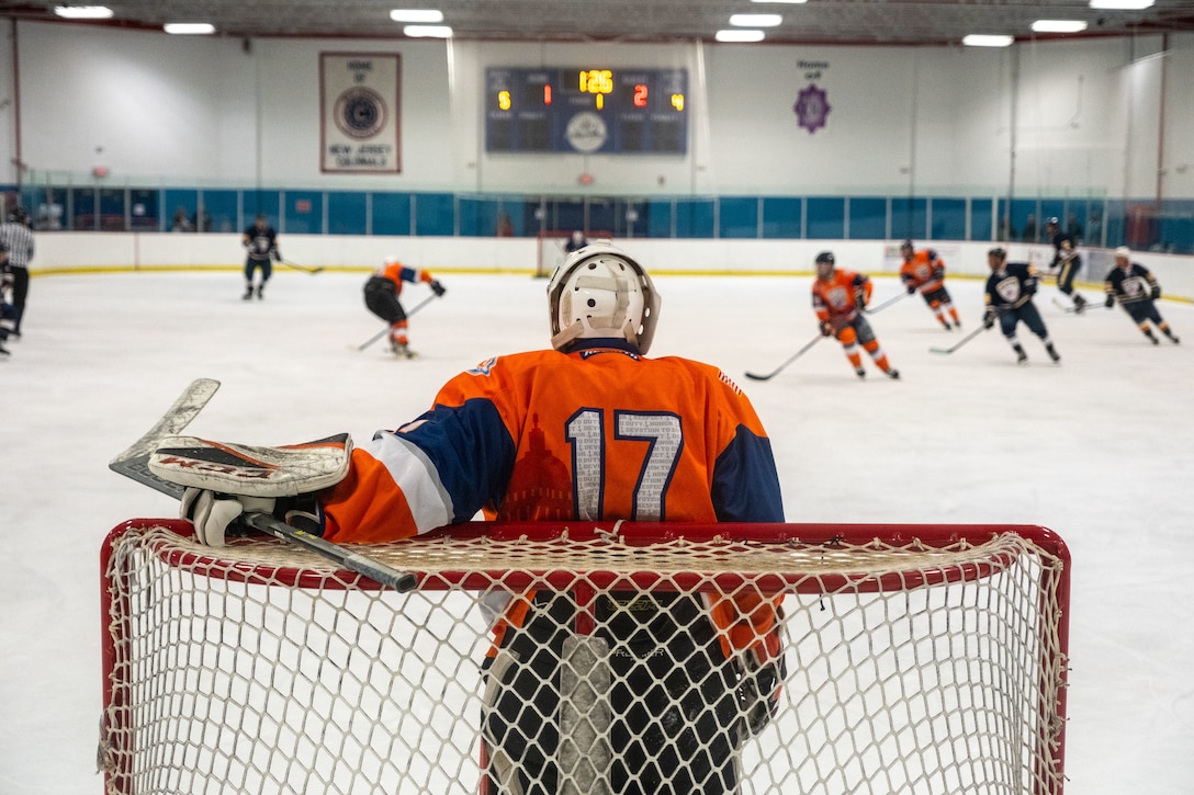 Aviation Maintenance Technician 3rd Class (AMT3) Andrew Slobiski stands in the goal during the first game against the Port Authority Police Department (PAPD) on September 14, 2024, in Morristown, New Jersey. The Coast Guard Hockey team claimed victory in the 2024 Tunnels to Towers Heroes Cup representing Coast Guard active duty, reserves, and veterans while raising funds for the Tunnel to Towers Foundation. (Coast Guard photo by Petty Officer 2nd Class Sydney Phoenix)