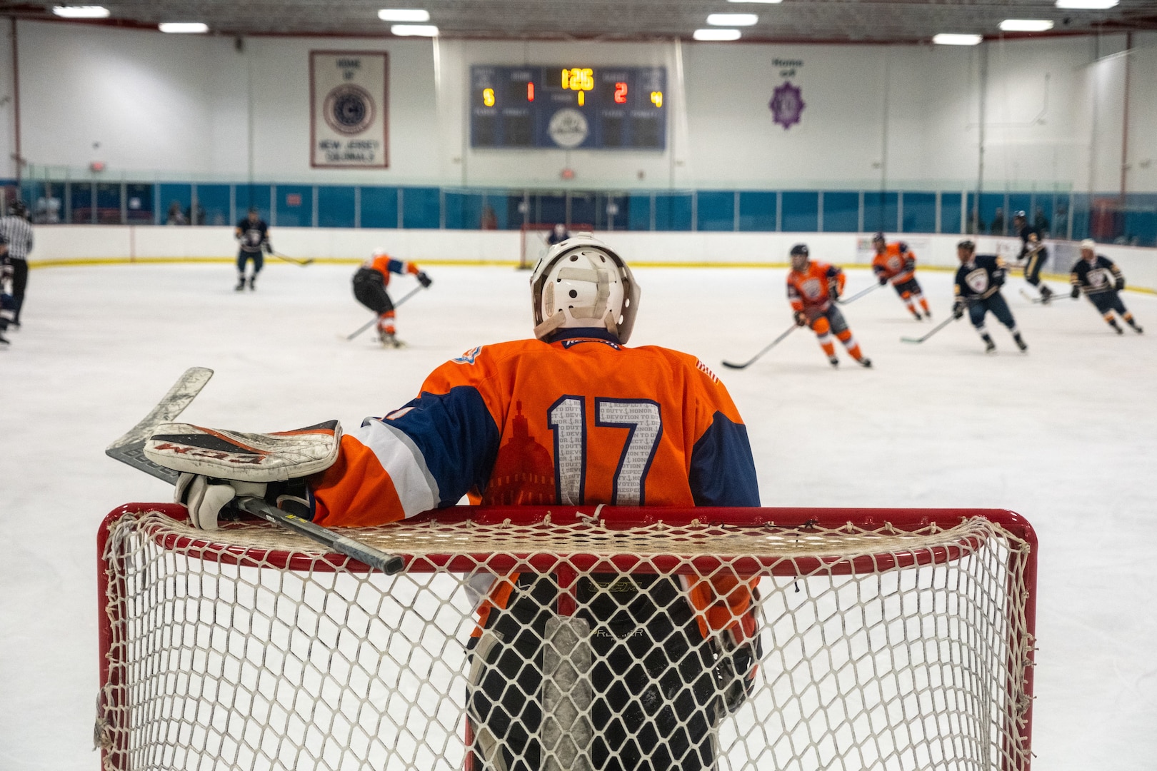 Aviation Maintenance Technician 3rd Class (AMT3) Andrew Slobiski stands in the goal during the first game against the Port Authority Police Department (PAPD) on September 14, 2024, in Morristown, New Jersey. The Coast Guard Hockey team claimed victory in the 2024 Tunnels to Towers Heroes Cup representing Coast Guard active duty, reserves, and veterans while raising funds for the Tunnel to Towers Foundation. (Coast Guard photo by Petty Officer 2nd Class Sydney Phoenix)