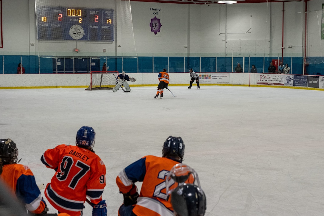 A Coast Guard Hockey team member attempts a goal during a shootout with the Port Authority Police Department (PAPD) in the 2024 Tunnels to Towers Heroes Cup on September 14, 2024, in Morristown, New Jersey. The Coast Guard Hockey team claimed victory in the 2024 Tunnels to Towers Heroes Cup, defeating FDNY in the semi-finals and shutting out Suffolk County Police Department in the final. (Coast Guard photo by Petty Officer 2nd Class Sydney Phoenix)