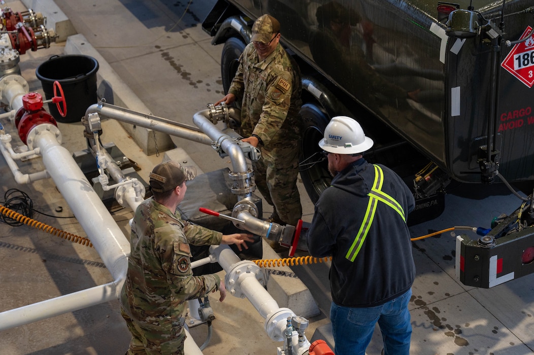 U.S. Air Force Airmen, assigned to the 354th Logistics Readiness Squadron, and contractors, with the North Pole Defense Fuel Supply Point, hook up an R11 aircraft refueling vehicle to a fill stand at North Pole, Alaska, Sept. 13, 2024.