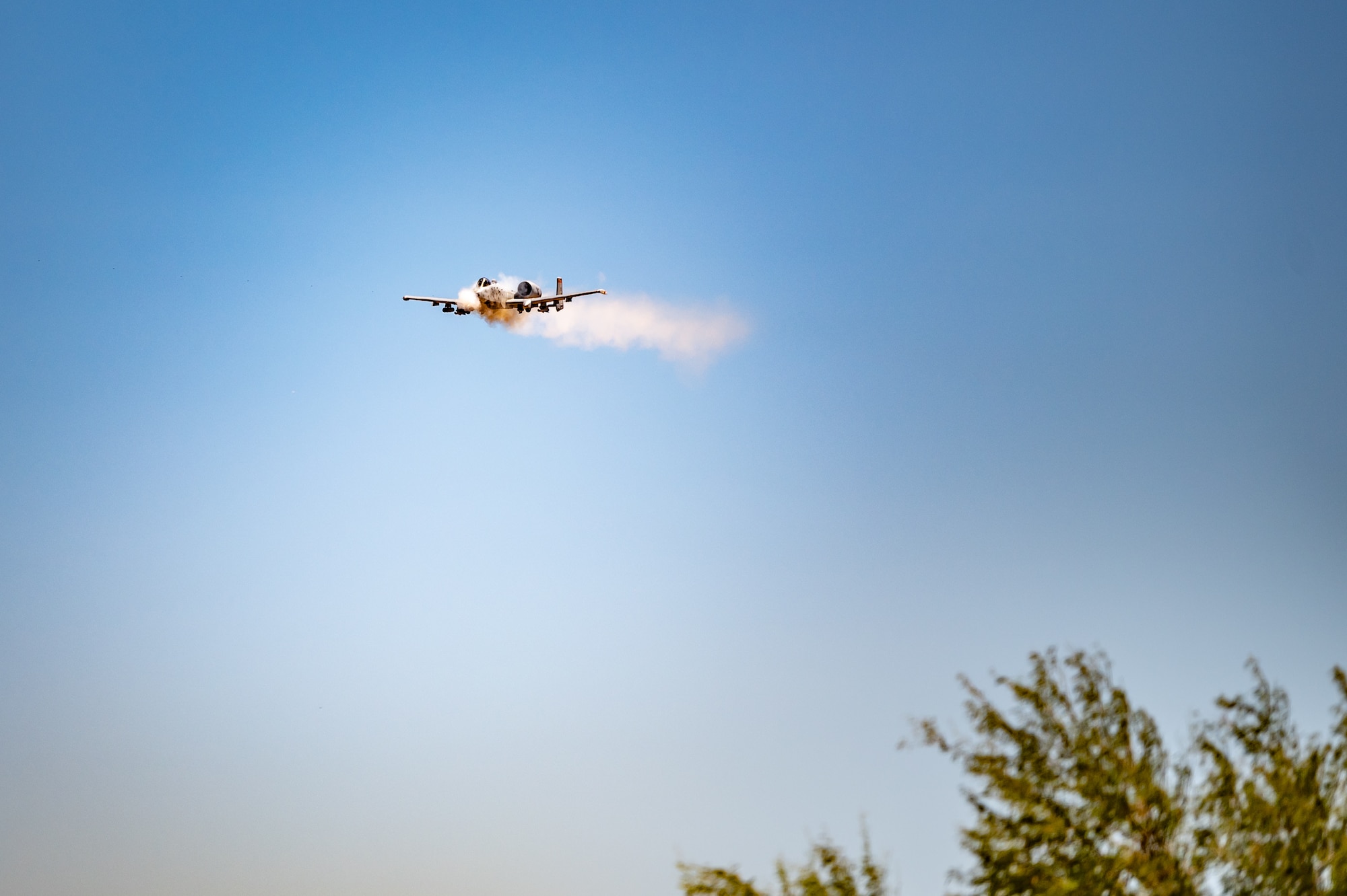An A-10 Thunderbolt II fires its GAU-8 Avenger 30mm Gatling gun during Hawgsmoke 2024 at the Barry M. Goldwater Range near Gila Bend, Ariz., on Sept. 13, 2024. The competition tested the A-10 pilots' skills in delivering precise firepower under combat conditions. (U.S. Air Force photo by Tech. Sgt. Tyler J. Bolken)