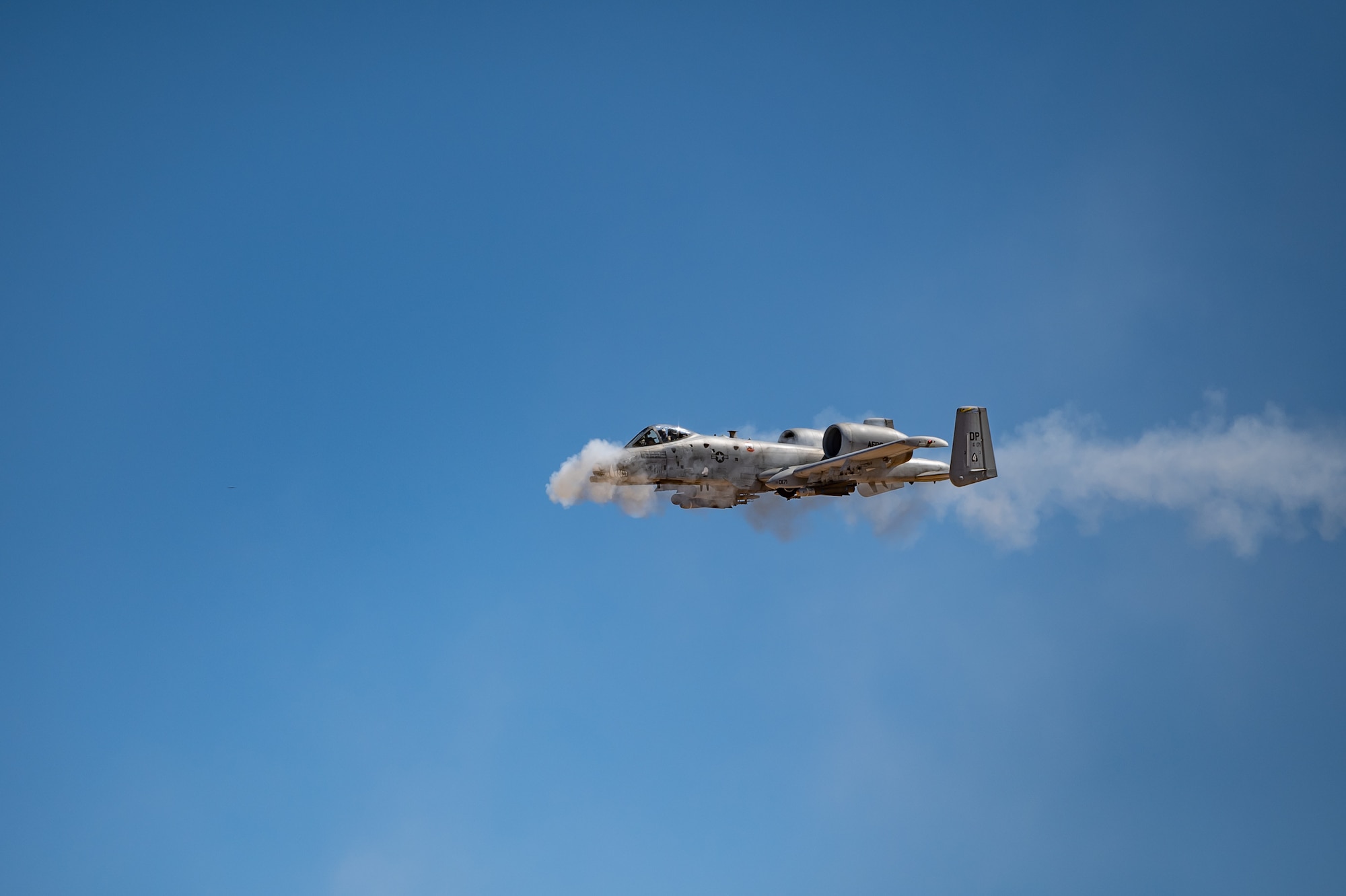 An A-10 Thunderbolt II from the 47th Fighter Squadron fires its GAU-8 Avenger 30mm Gatling gun at the Barry M. Goldwater Range near Gila Bend, Ariz., as part of the close air support competition during Hawgsmoke 2024 on Sept. 13, 2024. The 47th FS emerged victorious, reaffirming its position as the top attack team in the Air Force. (U.S. Air Force photo by Tech. Sgt. Tyler J. Bolken)