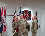 Medical Readiness Command East Commanding General, Brigadier General Lance Raney, passes the colors and all that it represents to incoming commander Col. Stephanie Mont during the Womack Army Medical Center Change of Command Ceremony, September 17, 2024, Weaver Auditorium.
