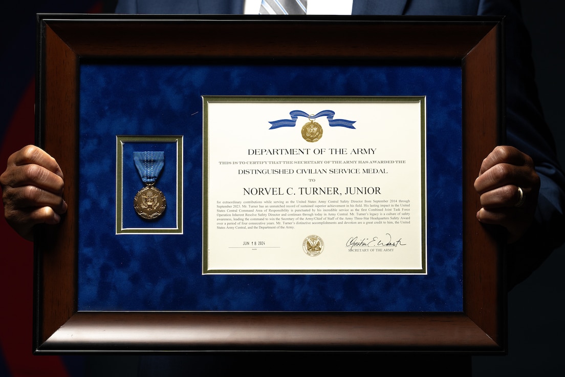 Mr. Norvel C. Turner Jr., U.S. Army Central Safety Director, holds his Distinguished Civilian Service Medal at Patton Hall, Shaw Air Force Base, South Carolina, Sept. 11, 2024. The medal recognizes Turner’s 52 years of dedicated service to the Army. (U.S. Army photo by Leo Jenkins)