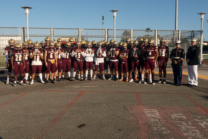 U.S. Marines with Recruiting Station San Diego and students pose for a group photograph during a military appreciation night at Point Loma High School in San Diego, Aug. 23, 2024. The military appreciation night was held to honor military service members and foster community connections. (U.S. Marine Corps photo by Staff Sgt. Jesula Jeanlouis)