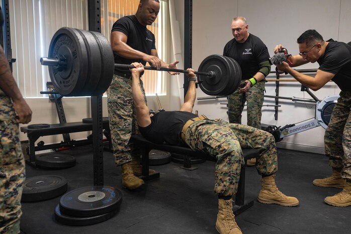 U.S. Marine Corps Sgt. Maj. Mike Gonzalez, the sergeant major of Recruiting Station Sacramento, benches in a weightlifting competition in Sacramento, Calif., August 27, 2024. Swole Mode was created to test the physical strength and endurance of Marines stationed at RS Sacramento and to build unit cohesion and Esprit de Corps. (U.S. Marine Corps photo by Sgt. Ryan Harvey)