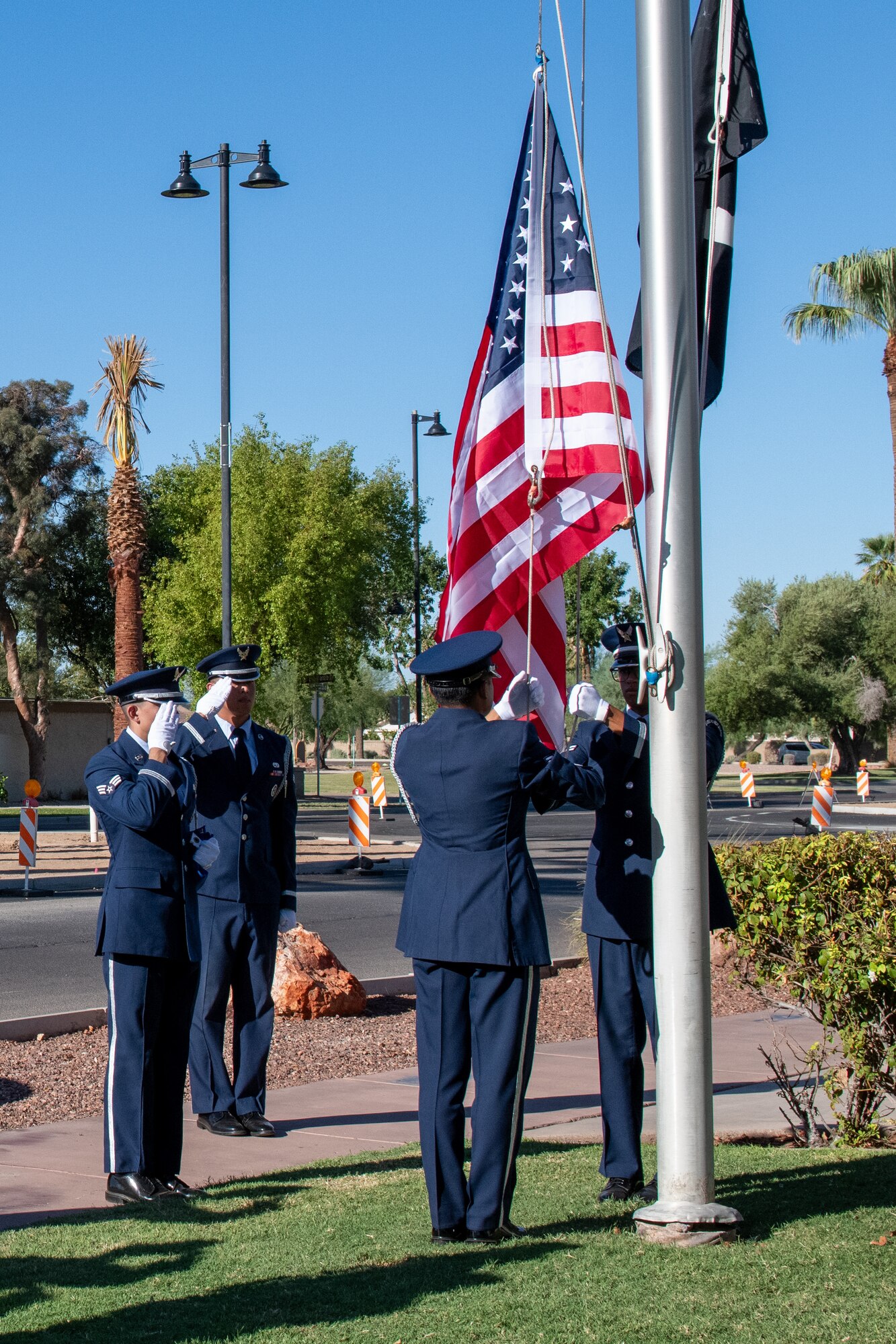 Luke Air Force Base Honor Guard performs a flag raising ceremony at Litchfield Park City Hall, saluting the American flag, Sept. 18, 2024, in Litchfield Park, Arizona.