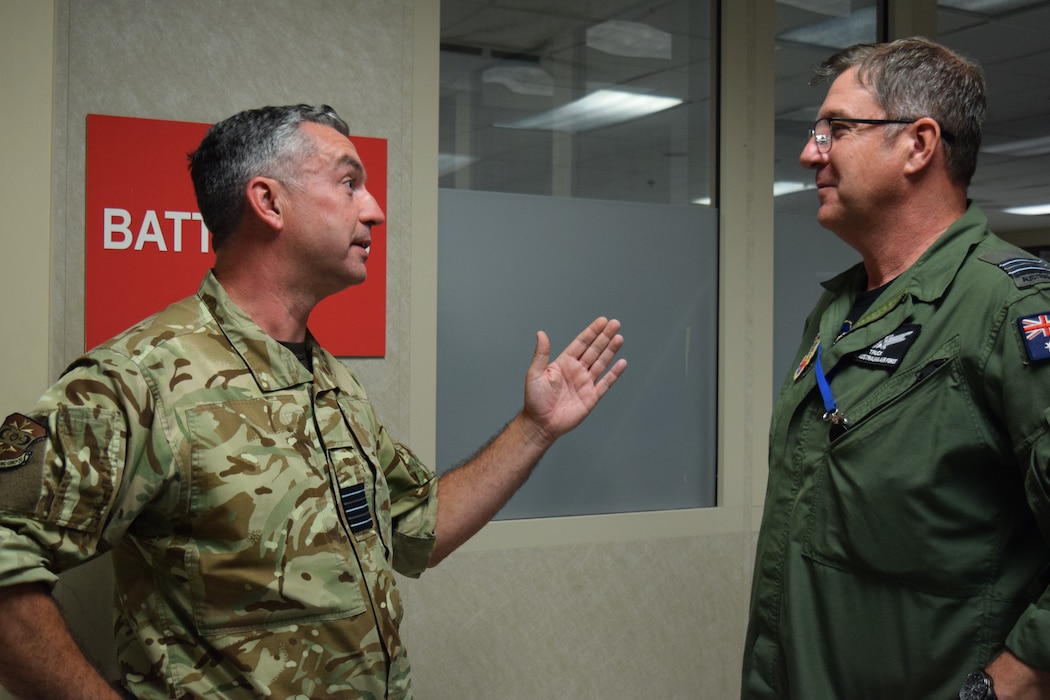 uniformed coalition members talking