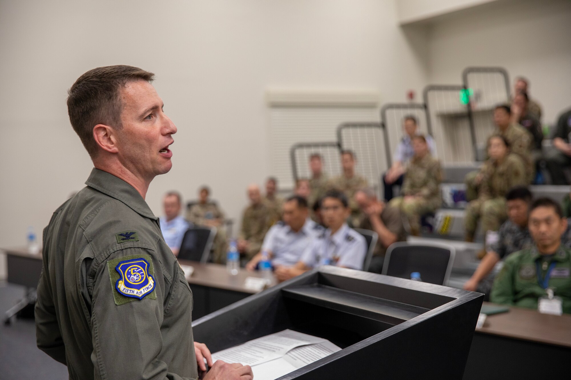 U.S. Air Force Col. John Schutte, 5th Air Force deputy commander, gives remarks during Far East Tactics Analysis Conference at Yokota Air Base, Japan, Sept. 13, 2024. The FETAT conference is an annual event that brings together operators and intelligence professionals from around the world to collaborate on information related to adversary air tactics, techniques, and procedures. This is the first year that representatives from Japan and Five Eyes (FVEY) partners, including Australia, Canada, New Zealand, and the United Kingdom participated. (U.S. Air Force photo by Yasuo Osakabe)