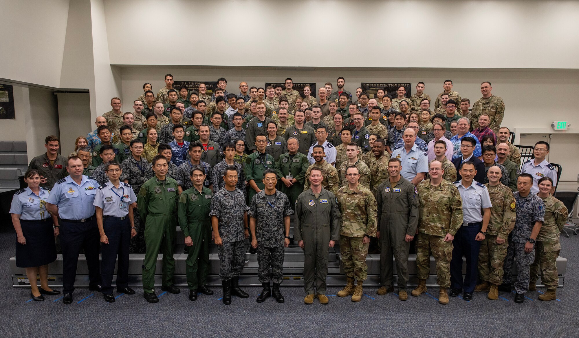 Far East Tactics Analysis Team conference attendees pose for a photo after the conference at Yokota Air Base, Japan, Sept. 13, 2024. The FETAT conference is an annual event that brings together operators and intelligence professionals from around the world to collaborate on information related to adversary air tactics, techniques, and procedures. This is the first year that representatives from Japan and Five Eyes (FVEY) partners, including Australia, Canada, New Zealand, and the United Kingdom participated. (U.S. Air Force photo by Yasuo Osakabe)