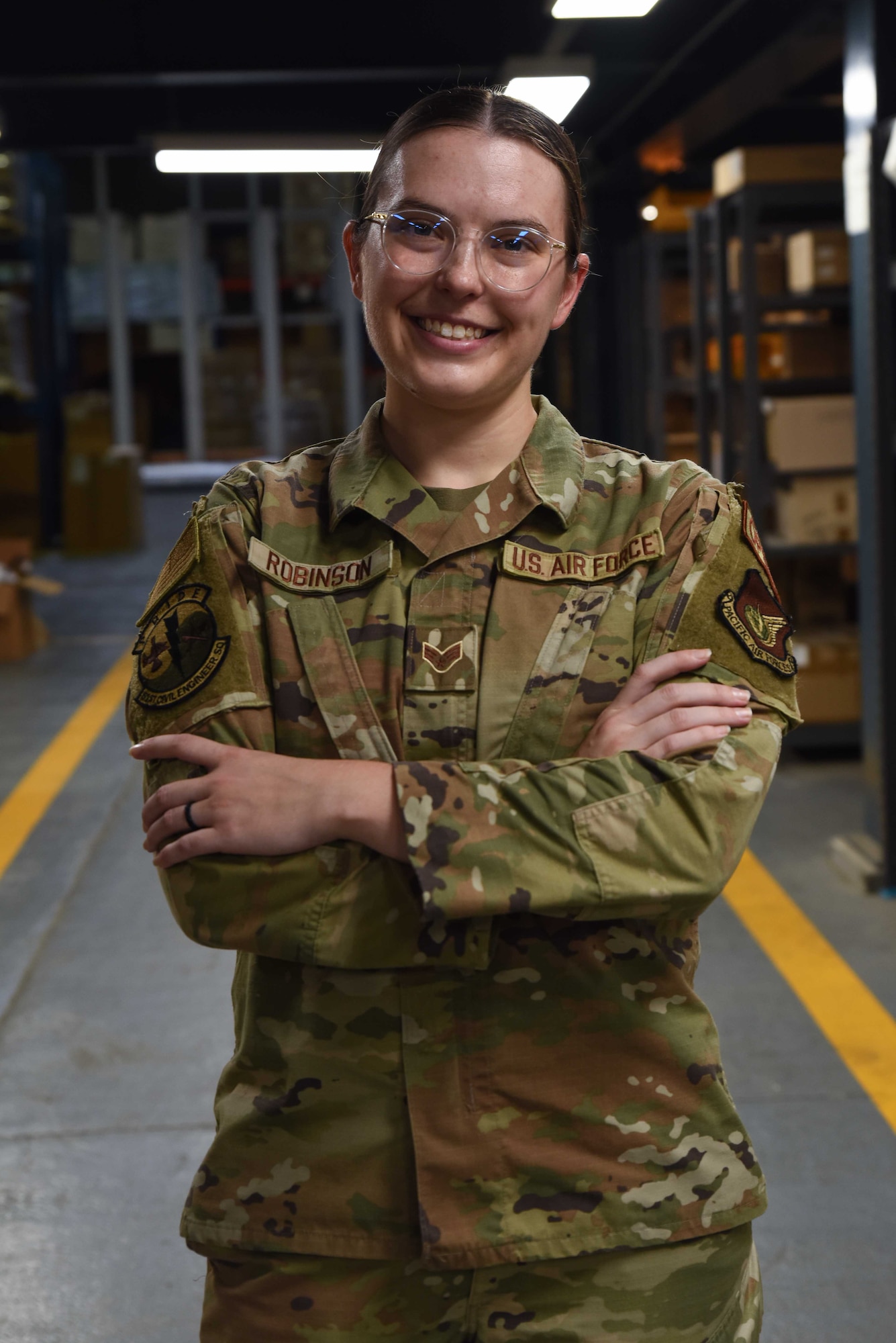 U.S. Air Force Senior Airman Raven Robinson, 51st Civil Engineer Squadron inventory technician, poses for a photo at Osan Air Base, Republic of Korea, Sept. 18, 2024. The 51st CES is a forward-deployed engineer squadron that supports personnel from the 7th Air Force, 51st Fighter Wing, 24 associate units and 7,000 residents. Robinson has been an asset to her team, earning her the title of Mustang of the Week. (U.S. Air Force photo by Staff Sgt. Kahdija Slaughter)
