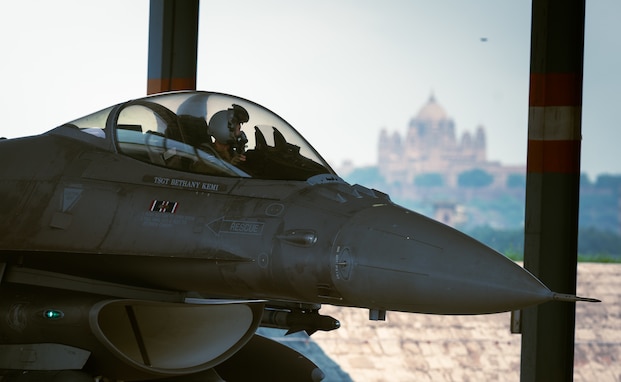 The Umaid Bawan Palace sits behind the Johdpur Air Station flightline as a 179th Expeditionary Fighter Squadron F-16 Fighting Falcon prepares for takeoff during Tarang Shakti-24 in Rajasthan, India, Sept. 5, 2024.