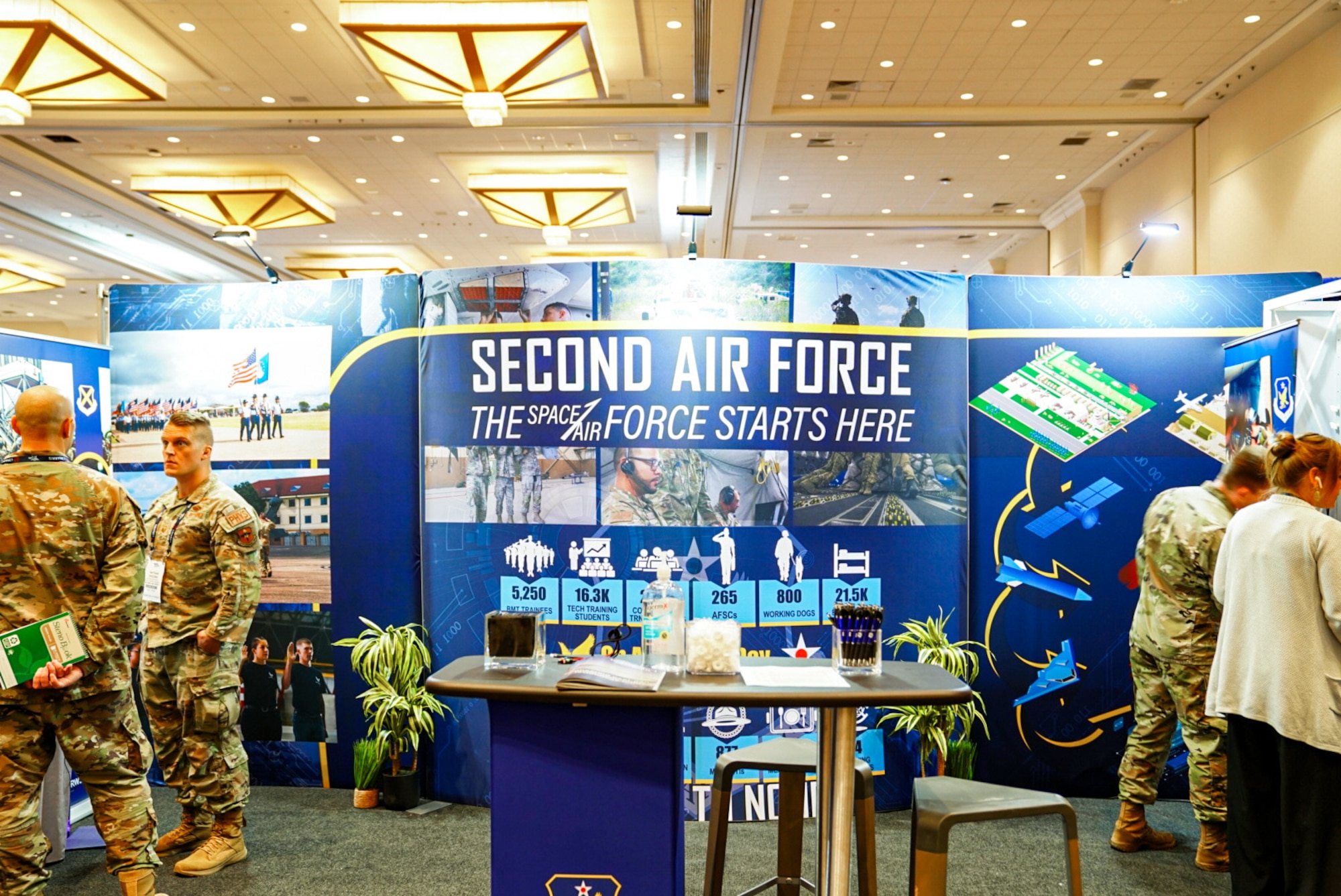 Second Air Force presenters prepare for a full day in the exhibit hall at the Air, Space and Cyber Conference in National Harbor, Md., Sept 16, 2024.