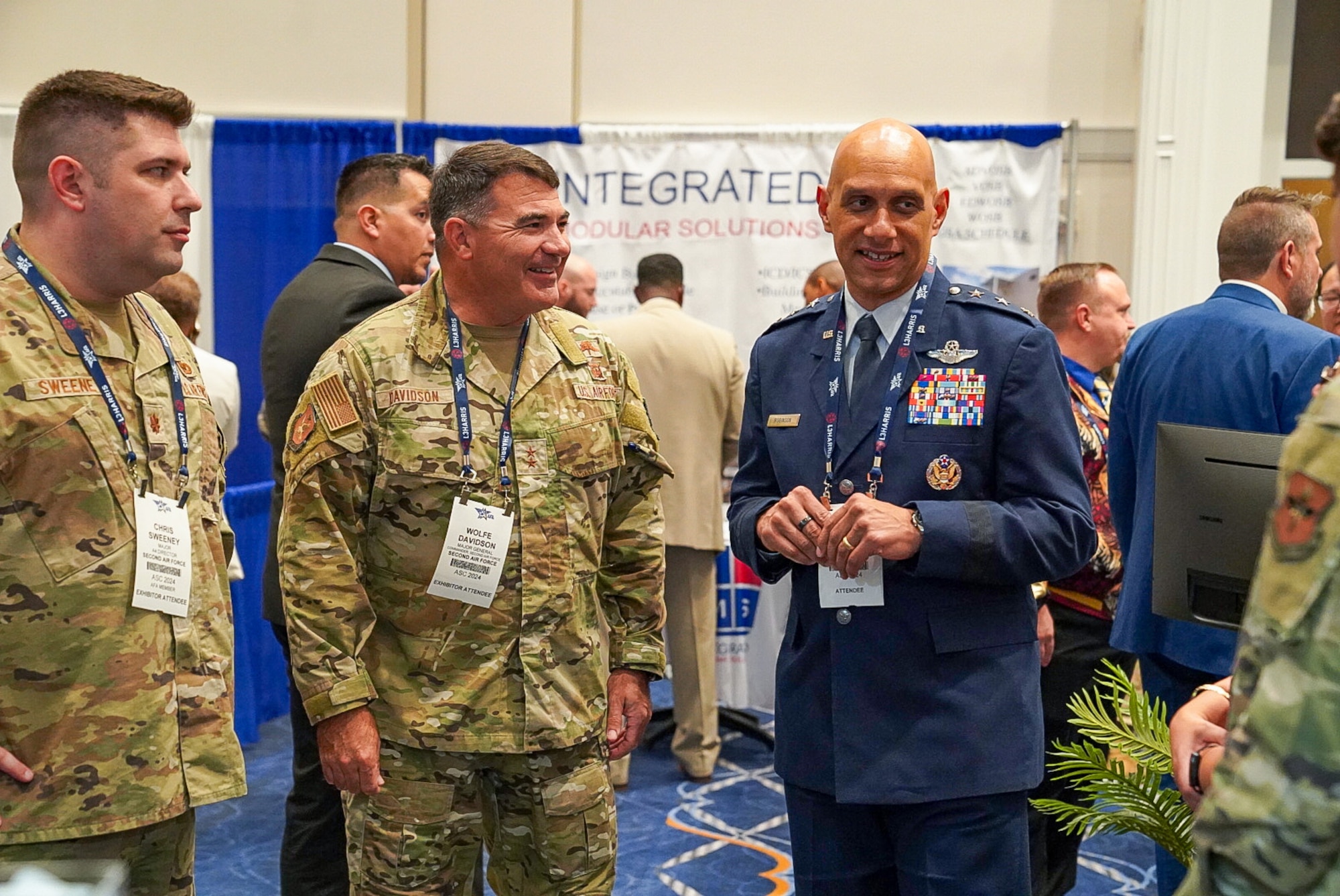 Lt. Gen. Brian Robinson, commander of Air Education and Training Command, speaks with Maj. Gen. Wolfe Davidson, Second Air Force commander, at the Air, Space and Cyber Conference, National Harbor, Md., Sept. 16, 2024.