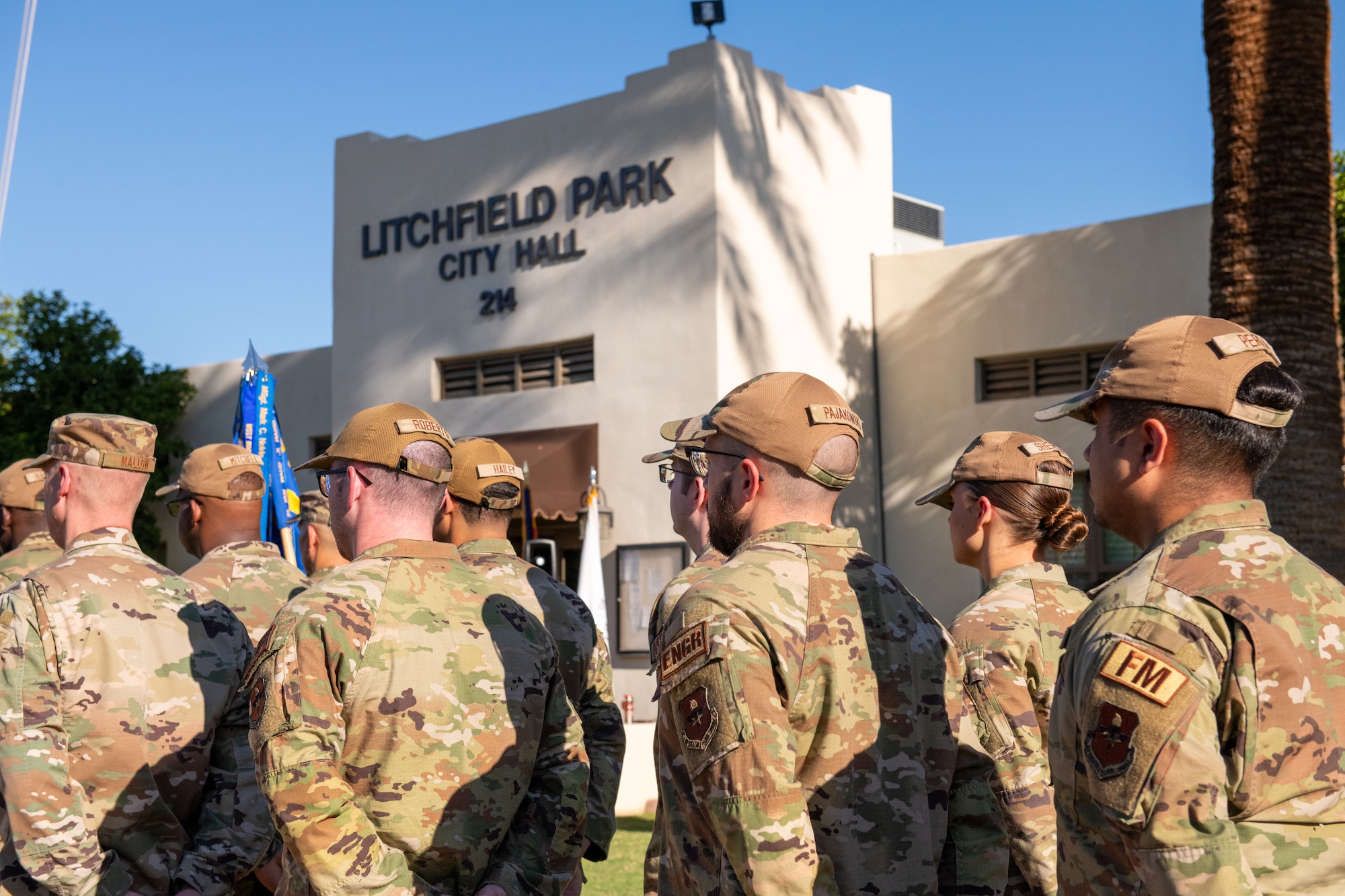 U.S. Air Force Airmen from the 56th Fighter Wing stand in formation as they await a flag raising ceremony to celebrate the Air Force’s 77th birthday at Litchfield Park City Hall, Sept. 18, 2024, in Litchfield Park, Arizona.