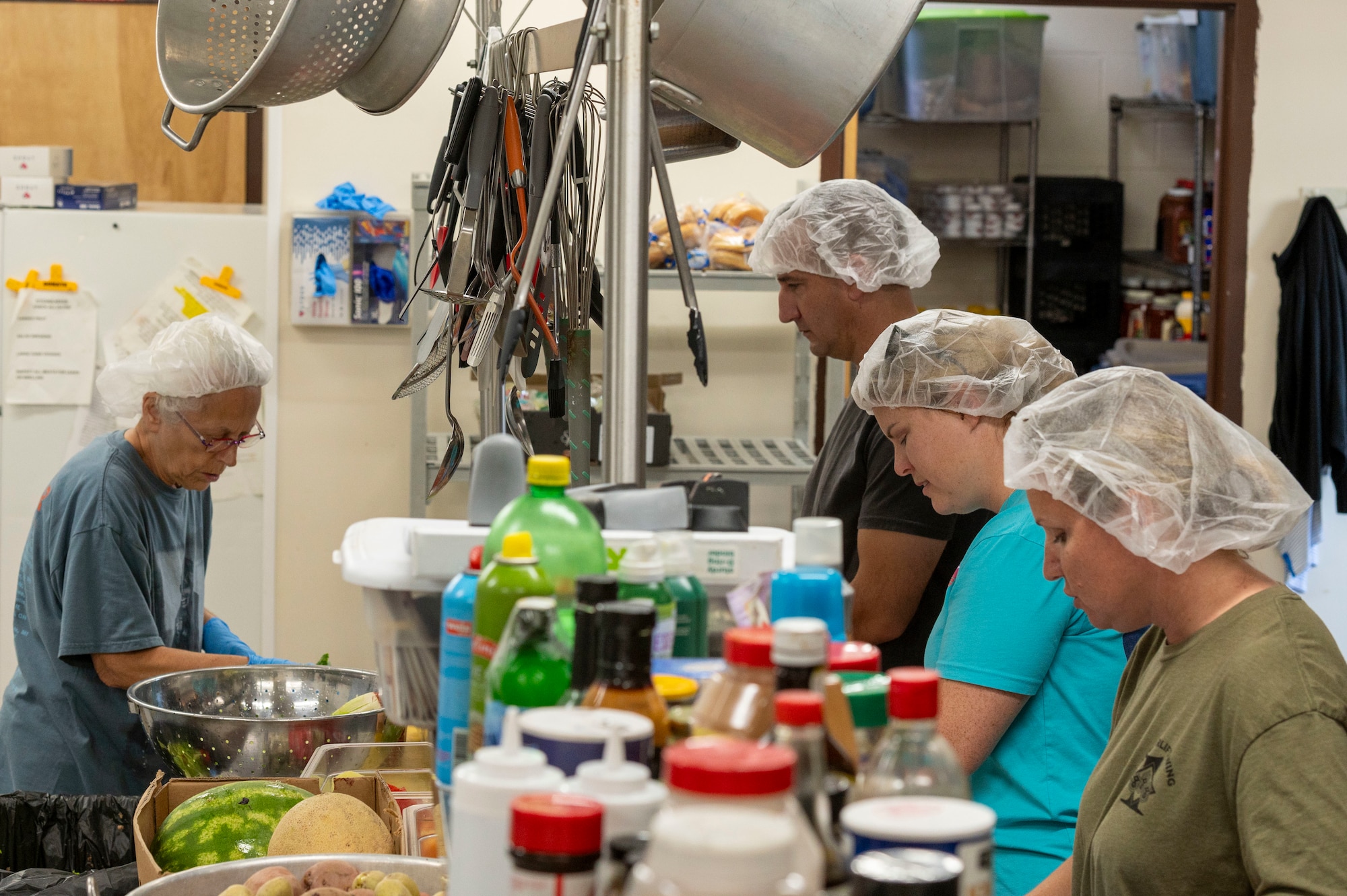 people work in a kitchen