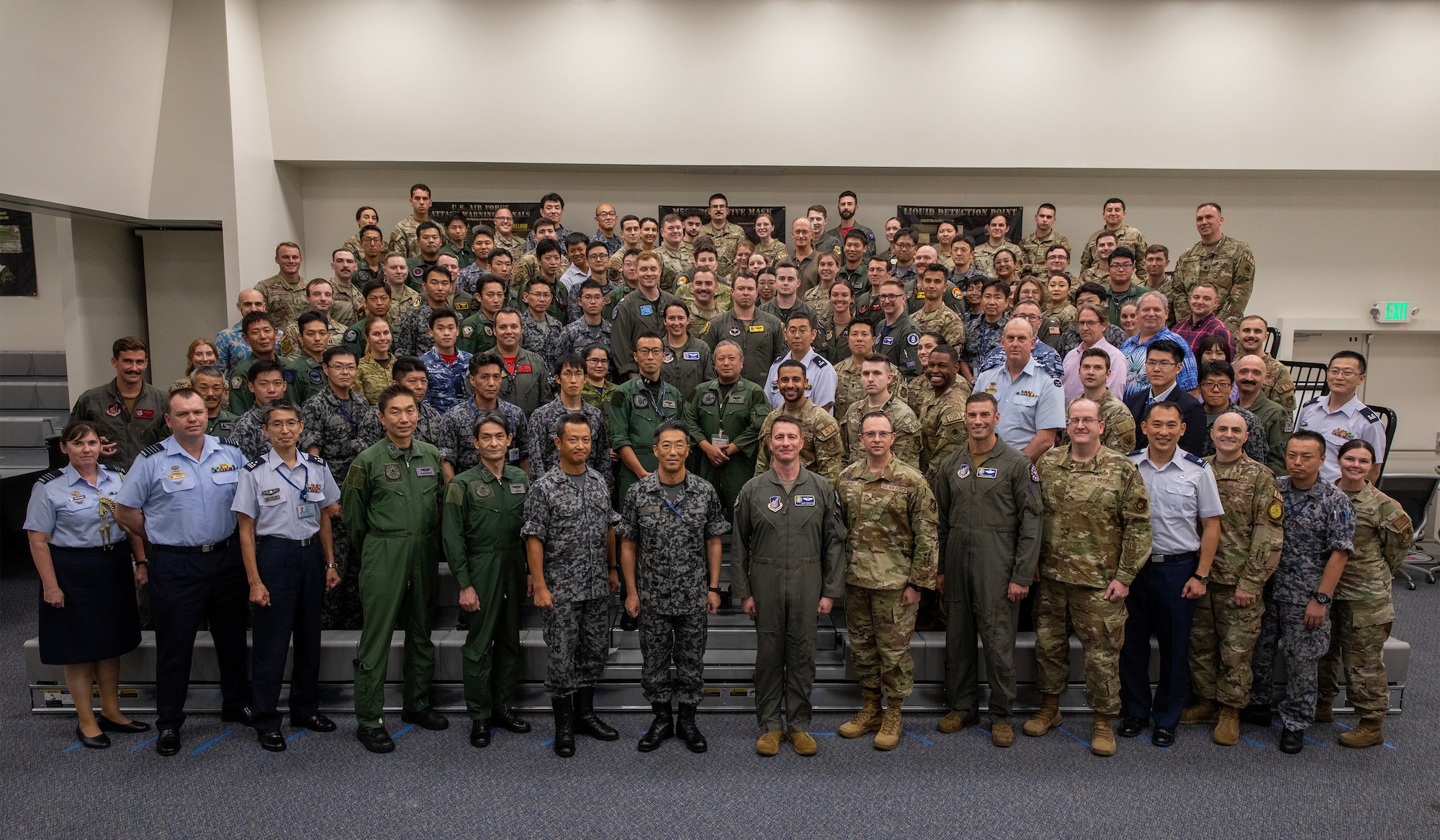 Far East Tactics Analysis Team conference attendees pose for a photo after the conference at Yokota Air Base, Japan, Sept. 13, 2024. The FETAT conference is an annual event that brings together operators and intelligence professionals from around the world to collaborate on information related to adversary air tactics, techniques, and procedures. This is the first year that representatives from Japan and Five Eyes (FVEY) partners, including Australia, Canada, New Zealand, and the United Kingdom participated. (U.S. Air Force photo by Yasuo Osakabe)