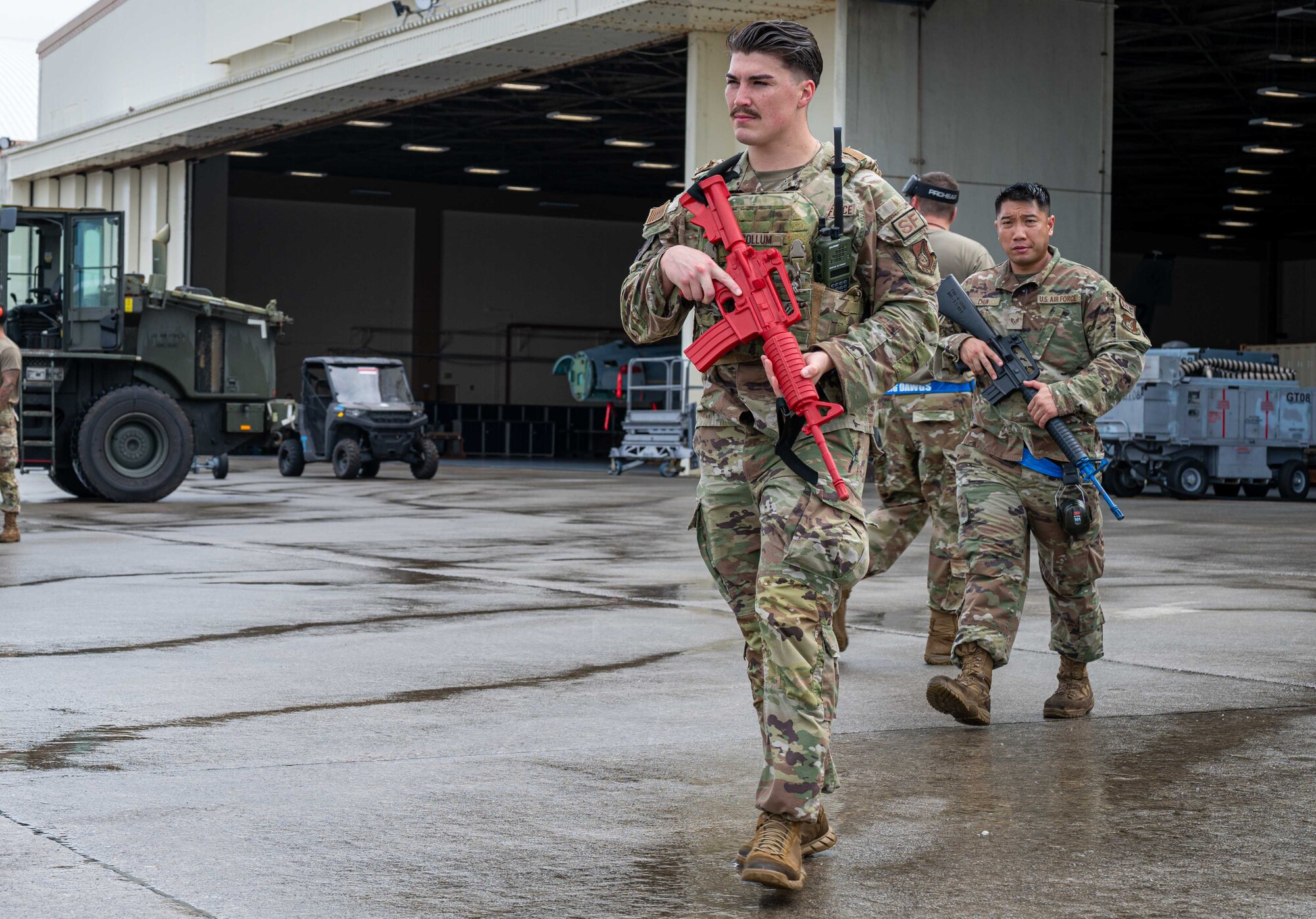 U.S. Air Force Senior Airman Caleb Collum, front, 18th Security Forces Squadron criminal investigator, and Senior Airman Jordan Chun, 199th Fighter Generation Squadron aerospace ground equipment journeyman, serve as security during an agile combat employment exercise, Shogun Shield, at Kadena Air Base, Japan, Sept. 18, 2024