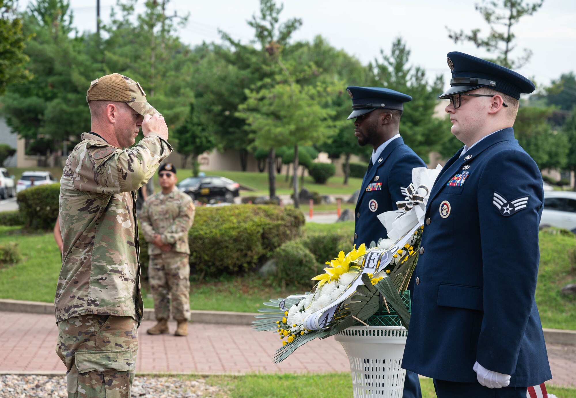 U.S. Air Force Col. Kevin Walsh, 51st Fighter Wing deputy commander, salutes a wreath during a POW/MIA recognition ceremony at Osan Air Base, Republic of Korea, Sept. 19, 2024. National POW/MIA recognition day ceremonies share the common purpose of honoring those who were held captive and returned, as well as those who remain missing in action. (U.S. Air Force photo by Staff Sgt. Christopher Tam)
