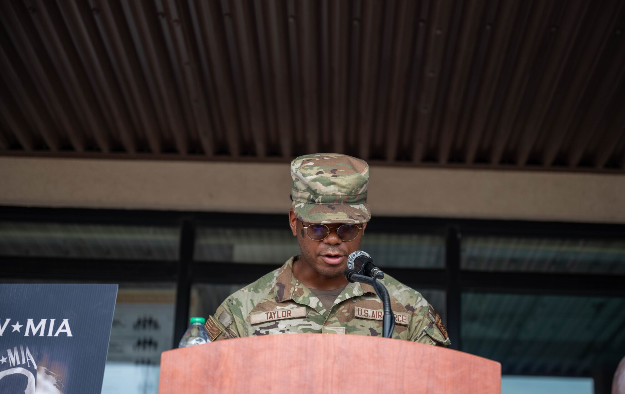 U.S. Air Force Airman 1st Class Elias Taylor, 51st Communications Squadron radio technician operator, reads names from the POW/MIA list during a POW/MIA recognition ceremony at Osan Air Base, Republic of Korea, Sept. 19, 2024. The event included the reading of names of POW/MIA service members as a way to honor and recognize their sacrifices. (U.S. Air Force photo by Staff Sgt. Christopher Tam)