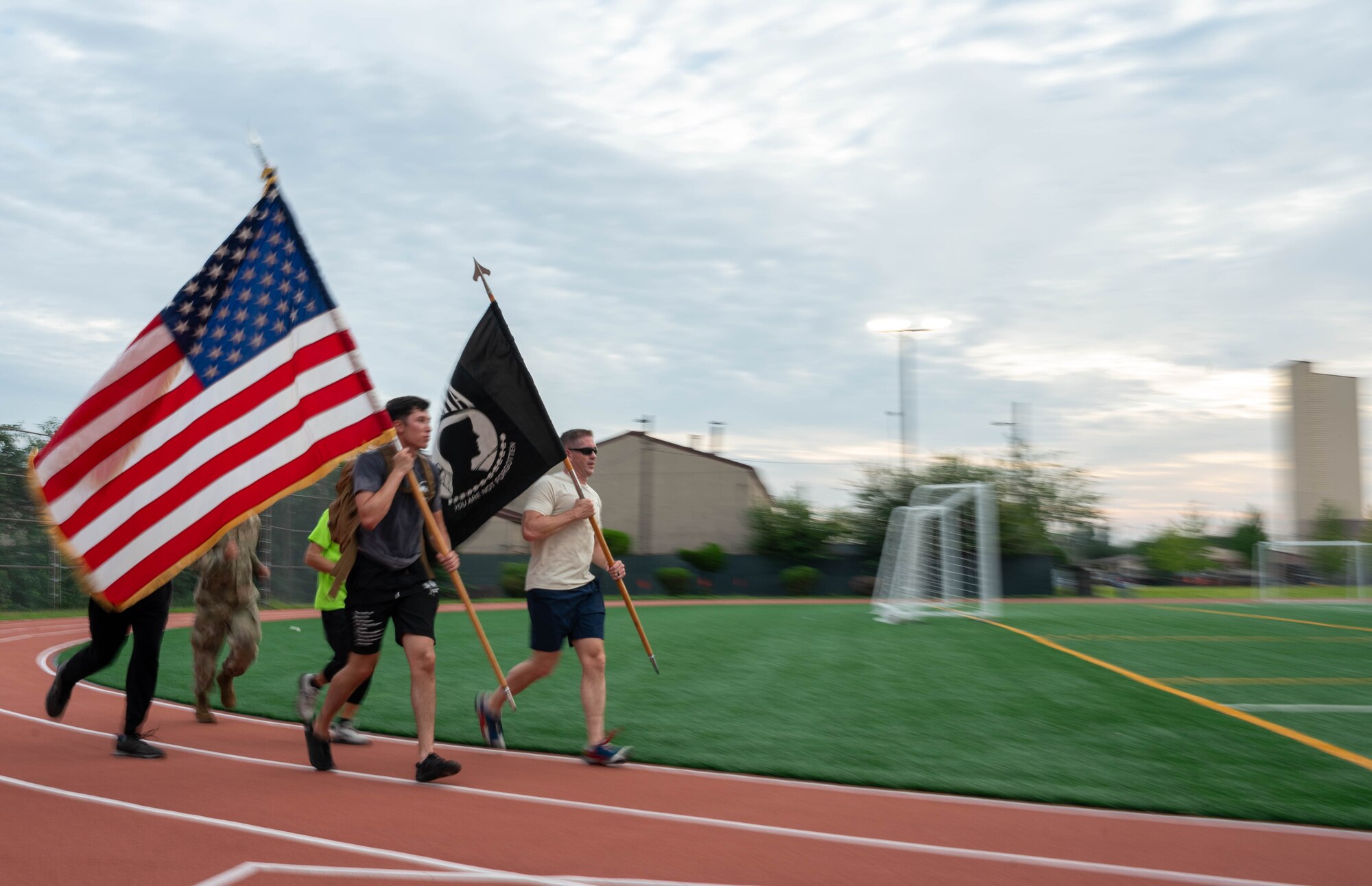 U.S. Air Force Airmen assigned to the 51st Fighter Wing participate in a POW/MIA recognition day run at Osan Air Base, Republic of Korea, Sept. 19, 2024. Service members, civilians and family members kept the flags in constant motion for a 24-hour period. (U.S. Air Force photo by Staff Sgt. Christopher Tam)