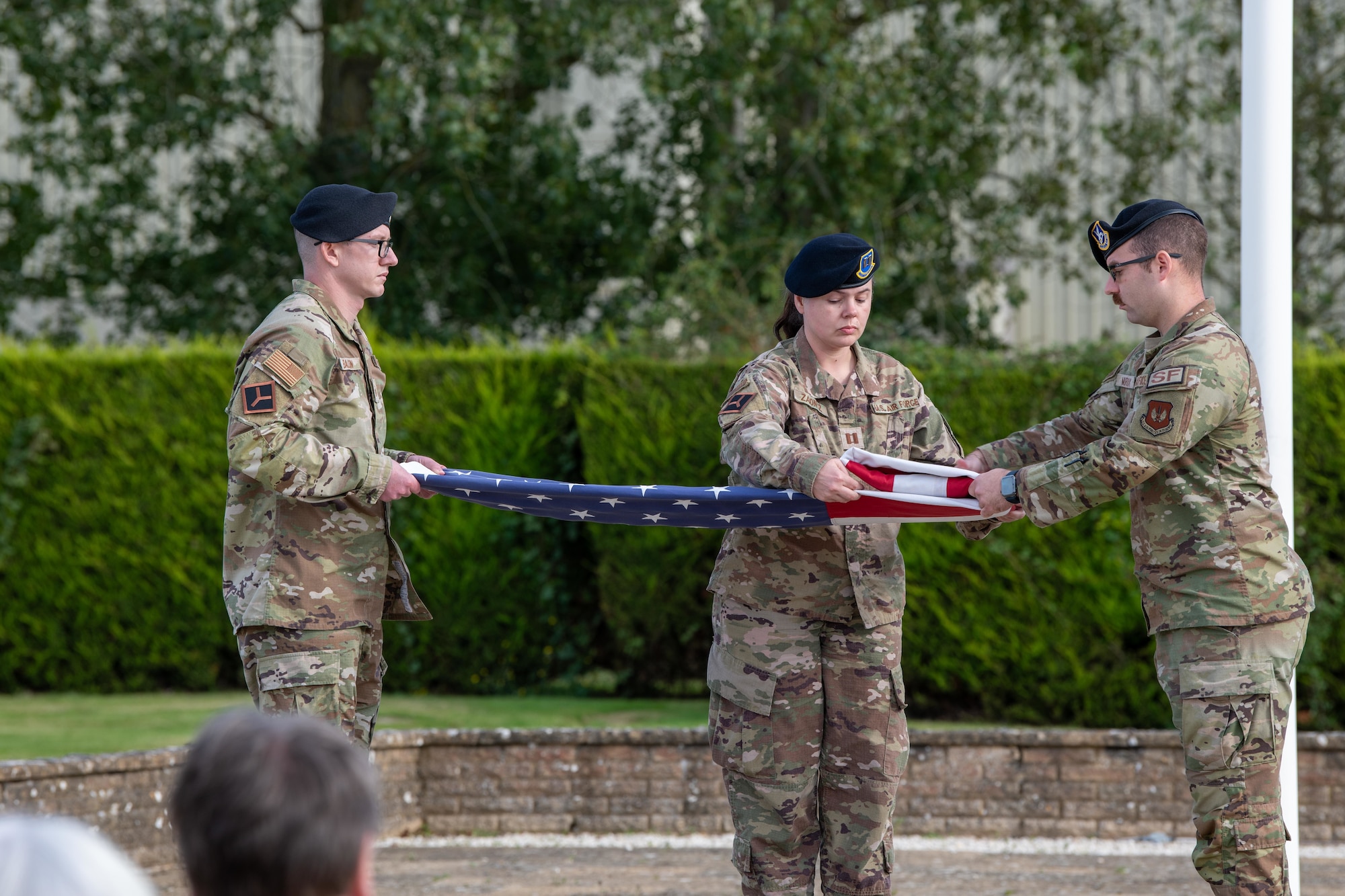 Pathfinders fold the U.S. flag during a retreat ceremony