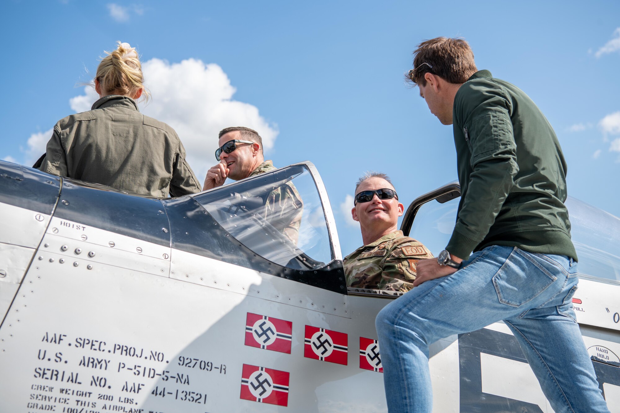 Airmen tour a P-51 Mustang during the RAF Fairford 80th Anniversary Heritage Day