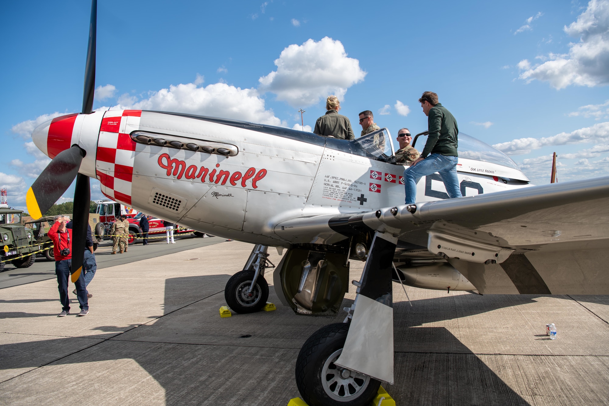 Airmen tour a P-51 Mustang during the RAF Fairford 80th Anniversary Heritage Day