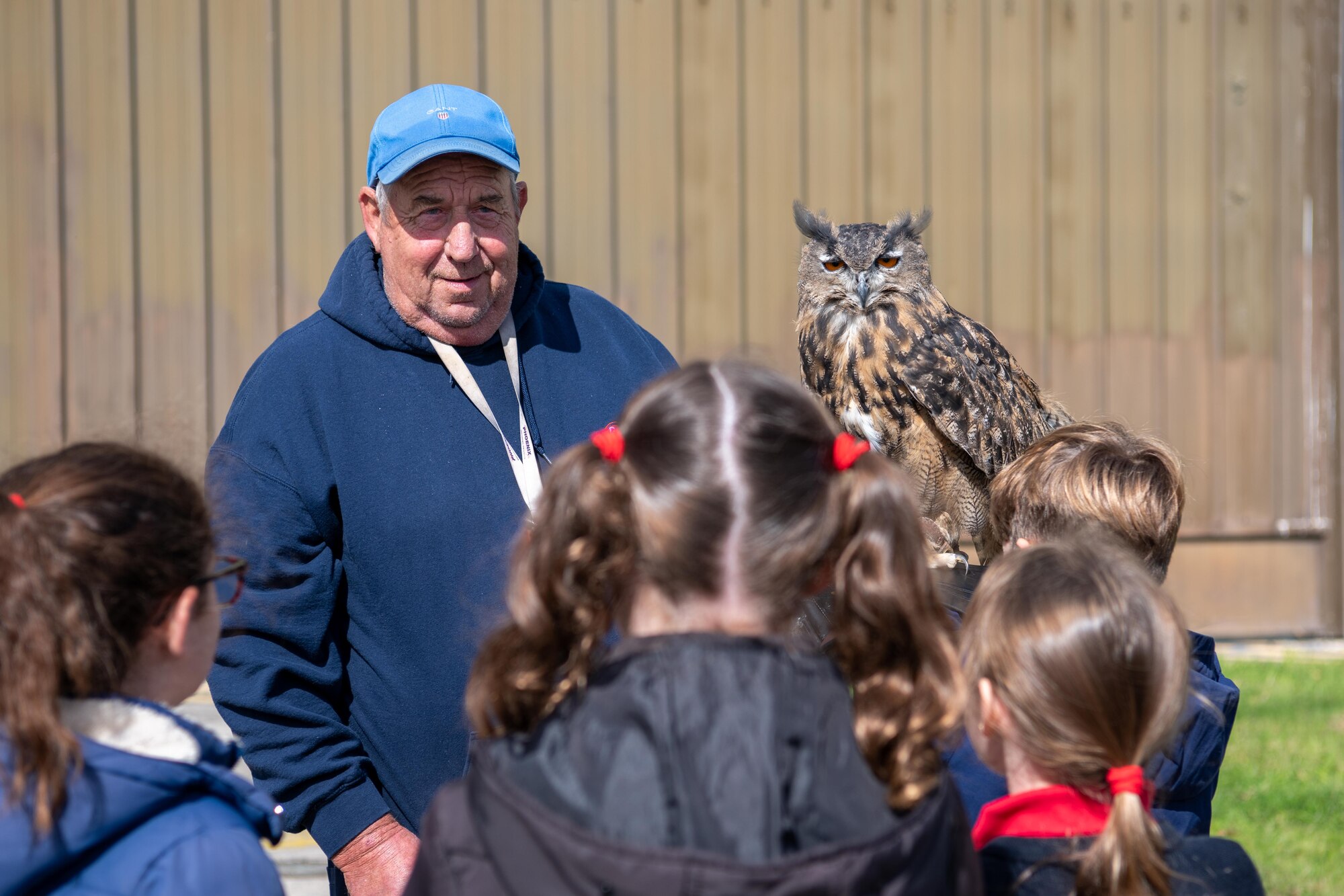 Man holds an eagle-owl