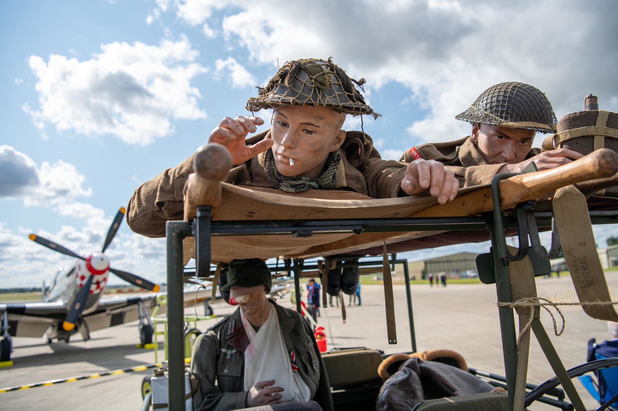 Mannequins depicting WWI British soldiers are displayed on the taxiway during the RAF Fairford 80th Anniversary Heritage Day