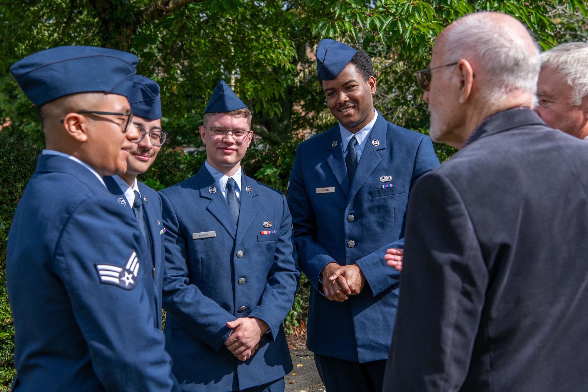 Airmen speak with other attendees after an 84th anniversary Battle of Britain commemoration service