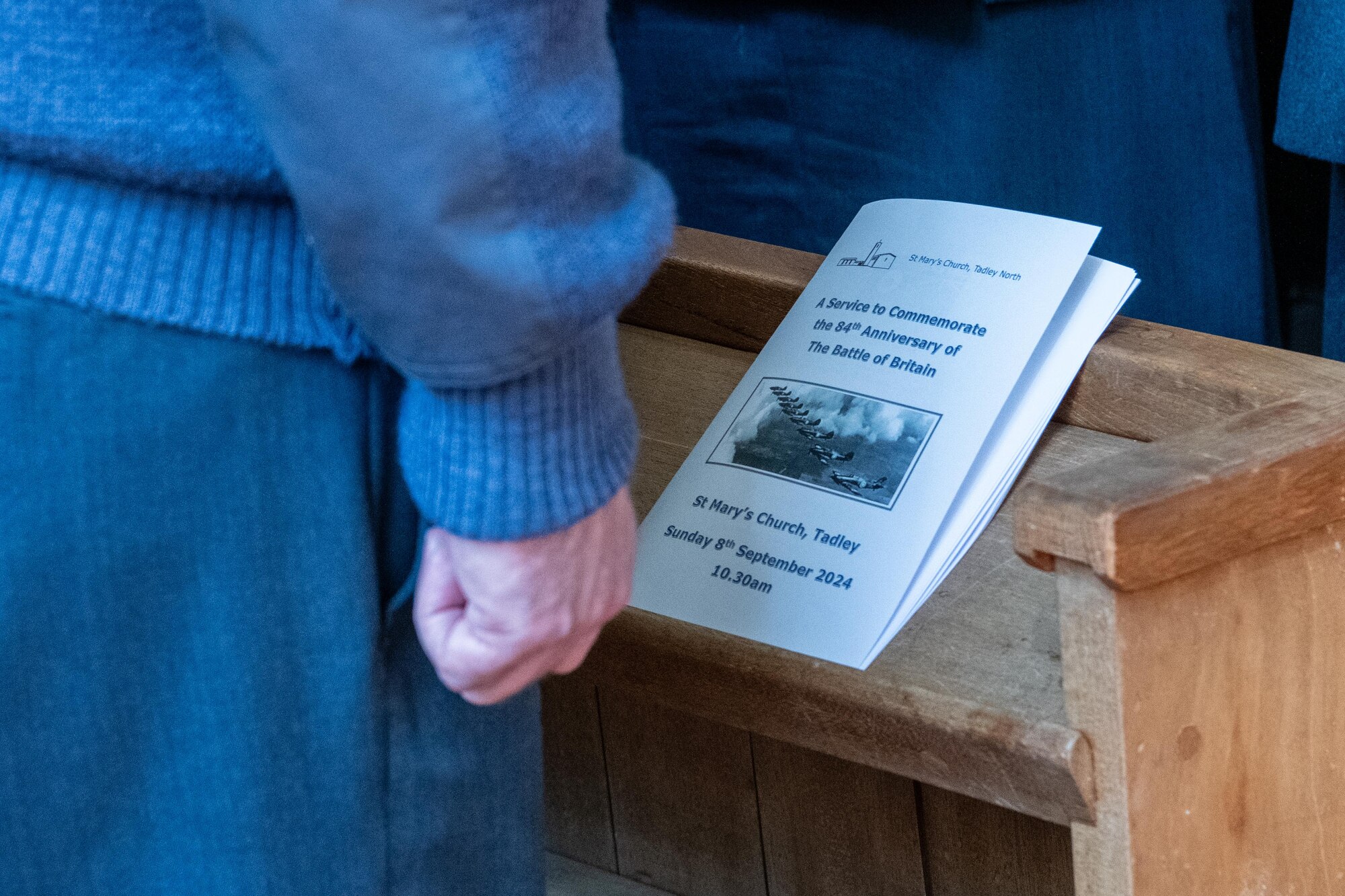 A program sits on a church pew during an 84th anniversary Battle of Britain commemoration service