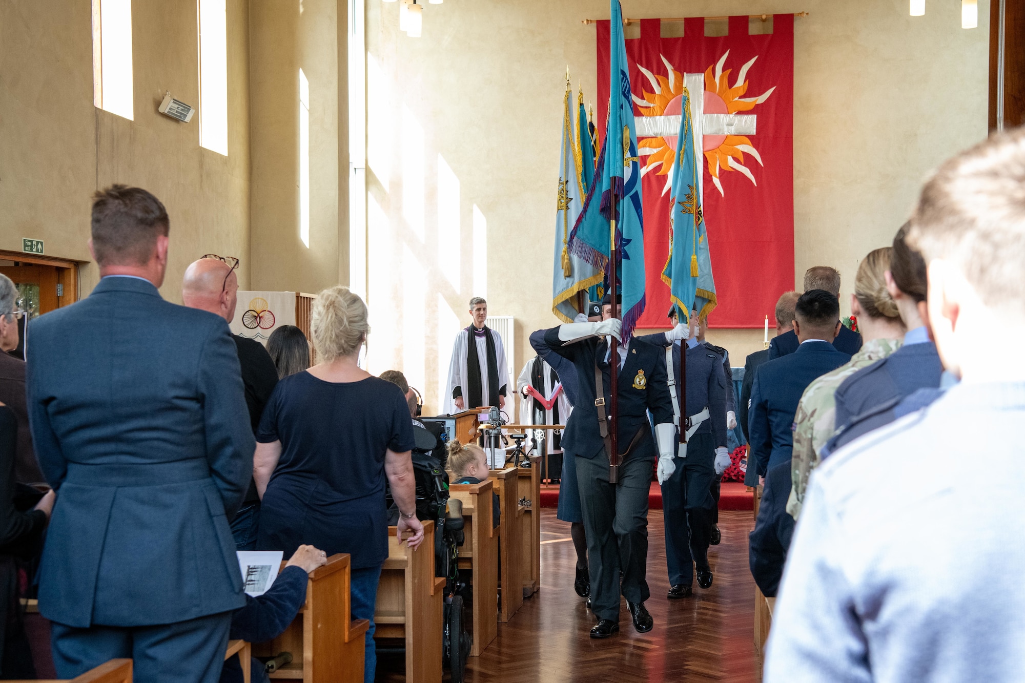 A flag detail marches off during an 84th anniversary Battle of Britain commemoration service