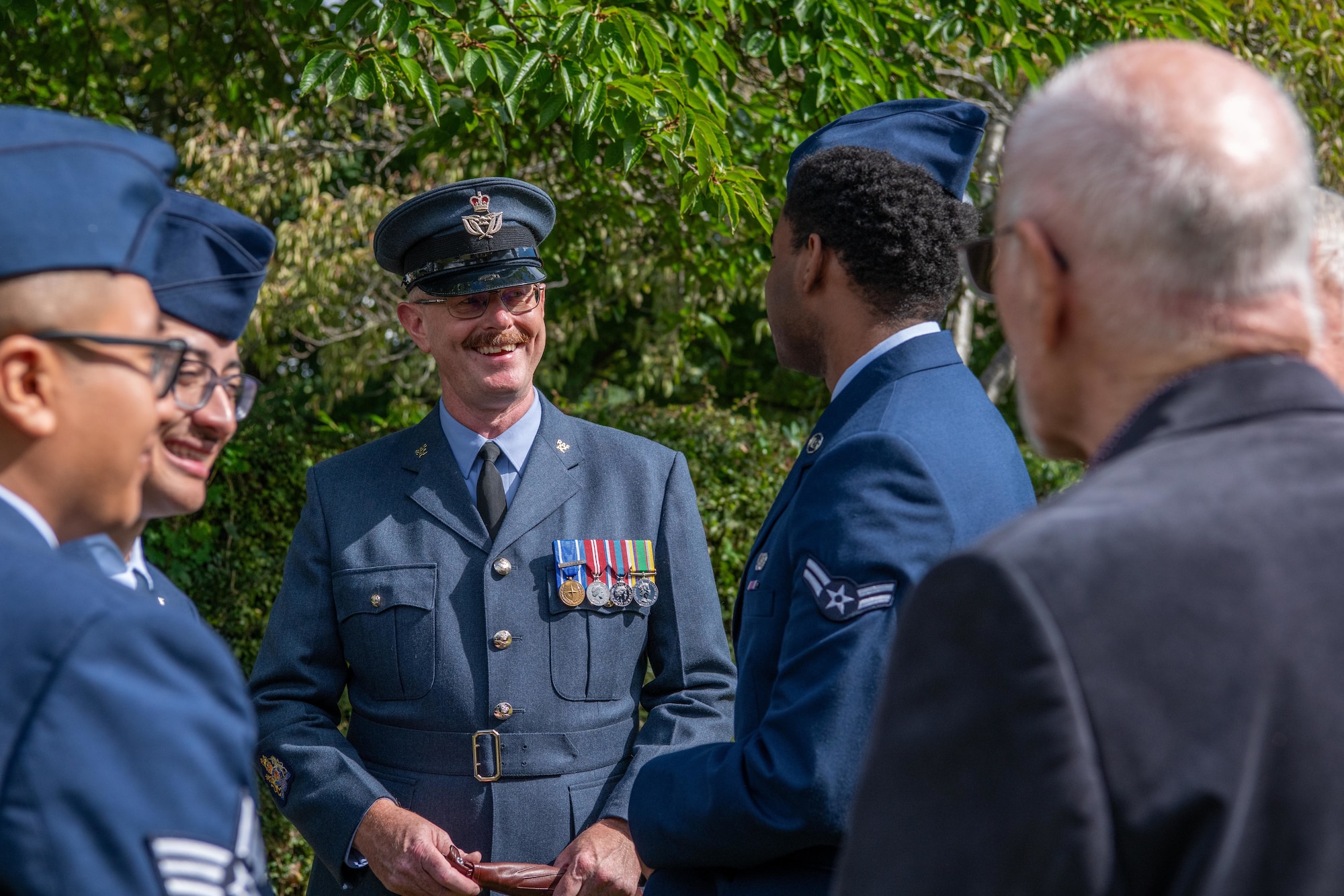 Attendees speak with each other after an 84th anniversary Battle of Britain commemoration service