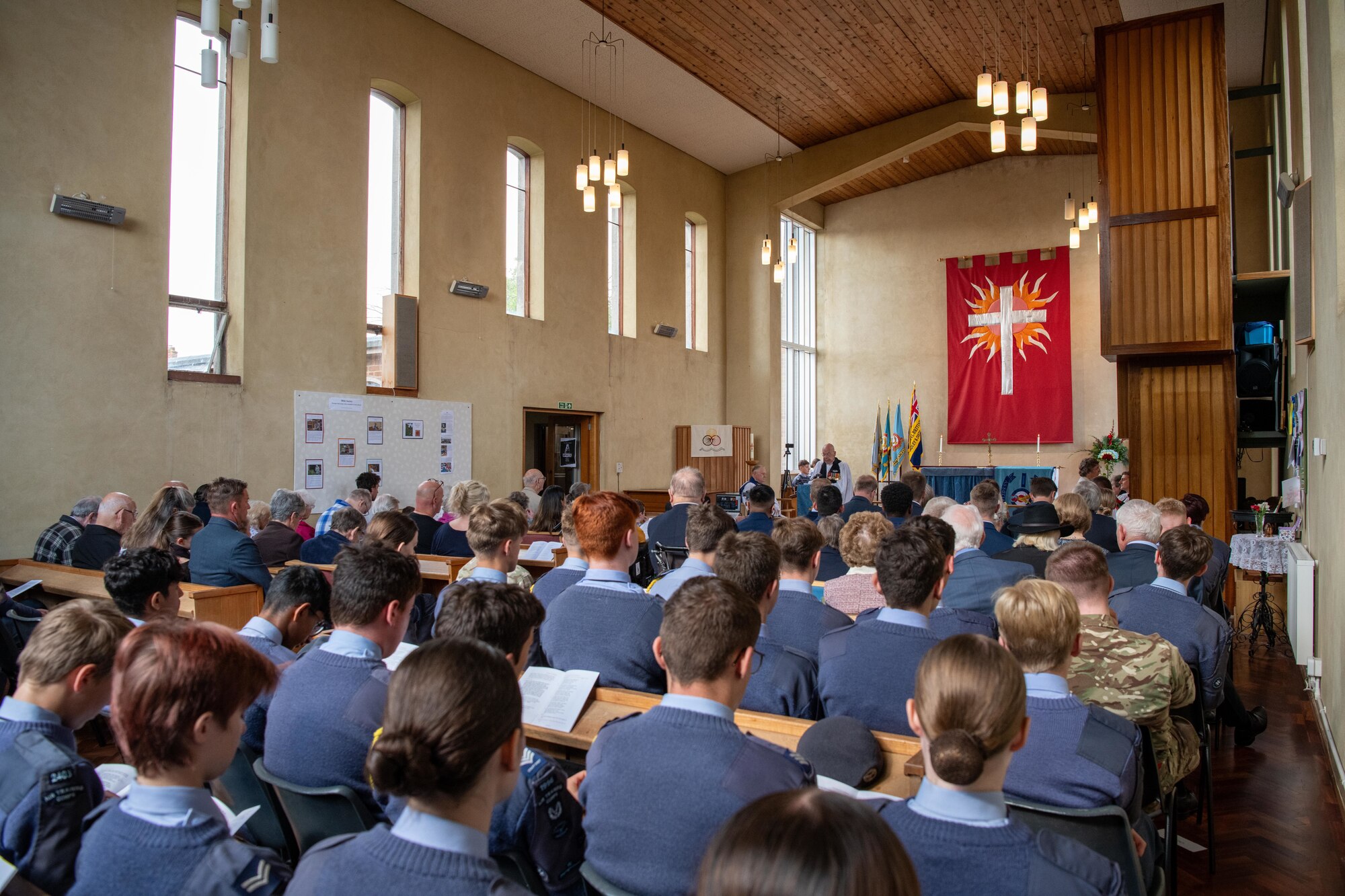 Attendees listen to a sermon during an 84th anniversary Battle of Britain commemoration service