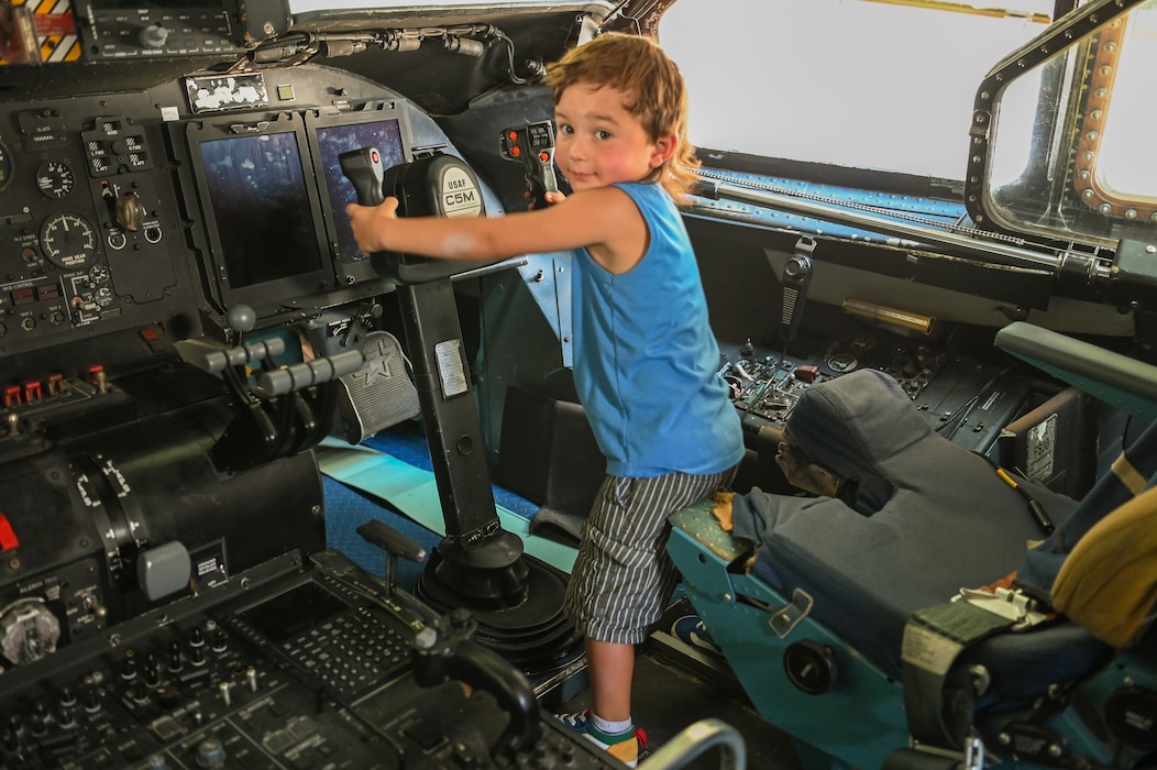 A young attendee lets his imagination run wild, pretending to fly a C-5M Super Galaxy, during a tour of the flight deck as part of the Alamo Wing’s Family Day at Joint Base San Antonio-Lackland, Texas Sept. 15, 2024.