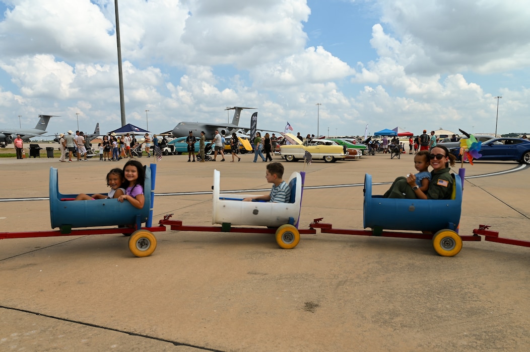 433rd Airlift Wing Reserve Citizen Airmen and their family members enjoy a day of food, live music, games and activities, including a car show and rides, during the Alamo Wing’s Family Day at Joint Base San Antonio-Lackland, Texas Sept. 15, 2024.