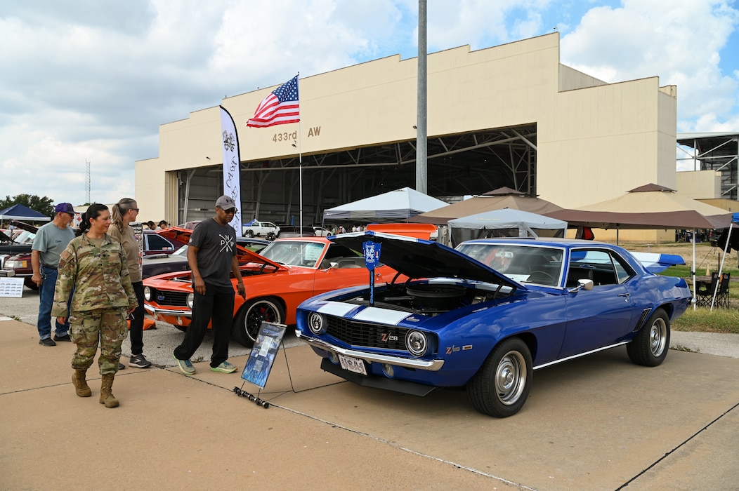 433rd Airlift Wing Reserve Citizen Airmen and their family members enjoy a day of food, live music, games and activities, including a car show, during the Alamo Wing’s Family Day at Joint Base San Antonio-Lackland, Texas Sept. 15, 2024.