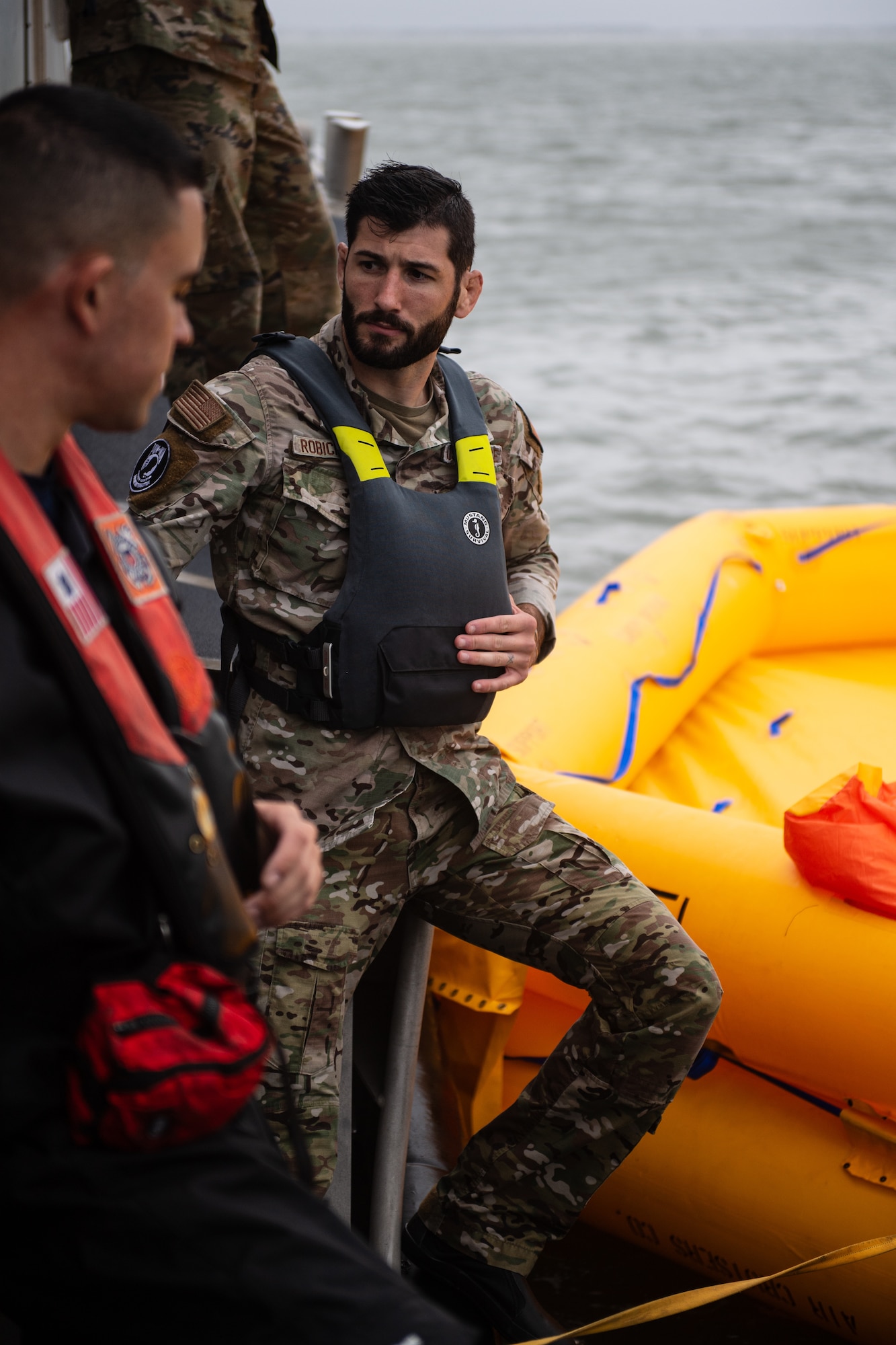 U.S. Air Force Staff Sgt. Max Robichaud, 436th Healthcare Operations Squadron medic, waits to board a life raft during Exercise Castaway 24-4 near Cape Henlopen State Park, Delaware, Sept. 18, 2024. Castaway 24-4 was a total force interagency training exercise designed to test and execute search and rescue procedures. (U.S. Air Force photo by Staff Sgt. Marco A. Gomez)